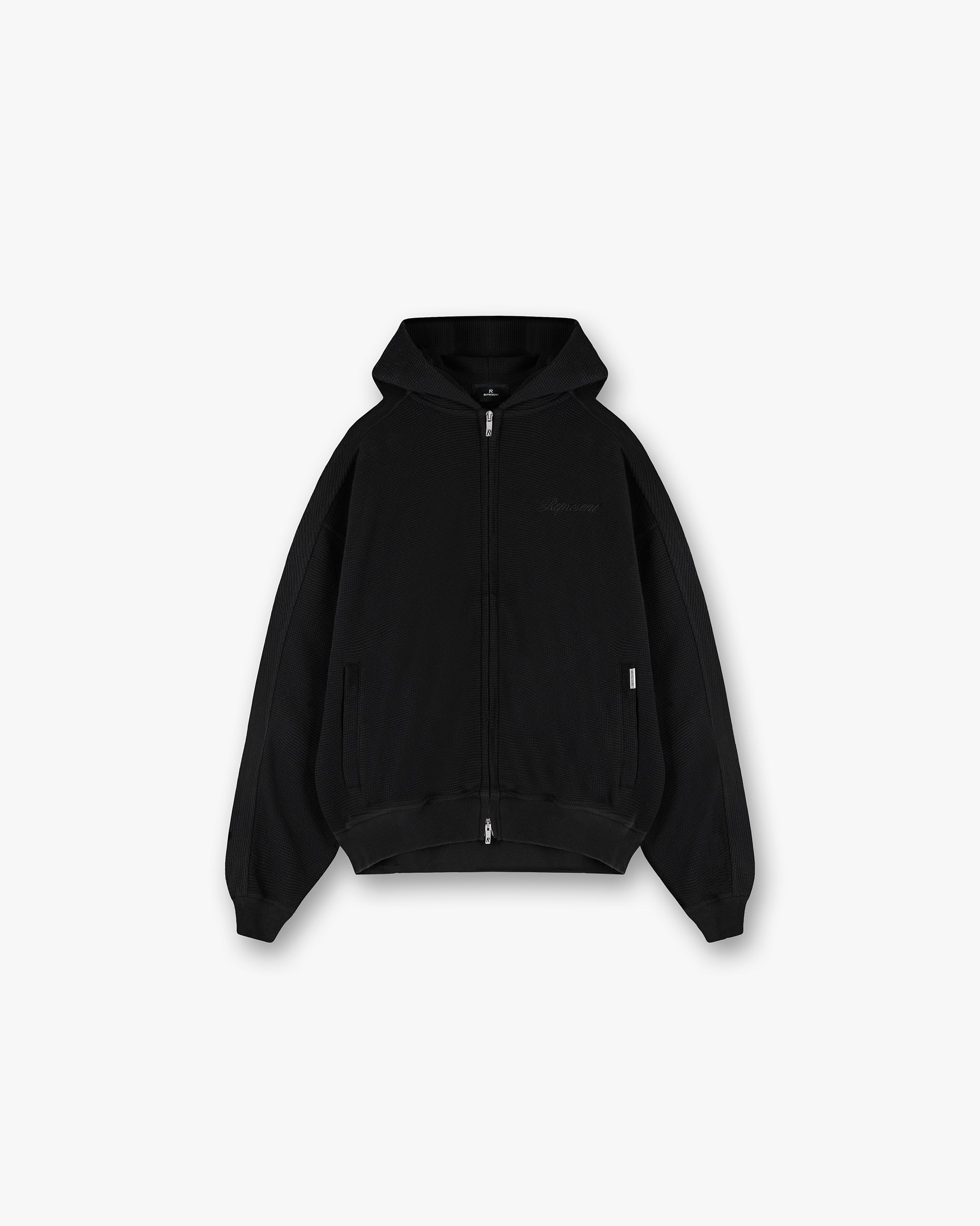 Front product image of a mens black hoodie on a plain white background | Waffle Zip Through Hoodie in Jet Black | Hoodie with polyamide blend fabric | SS25 Hoodies | Represent Clo