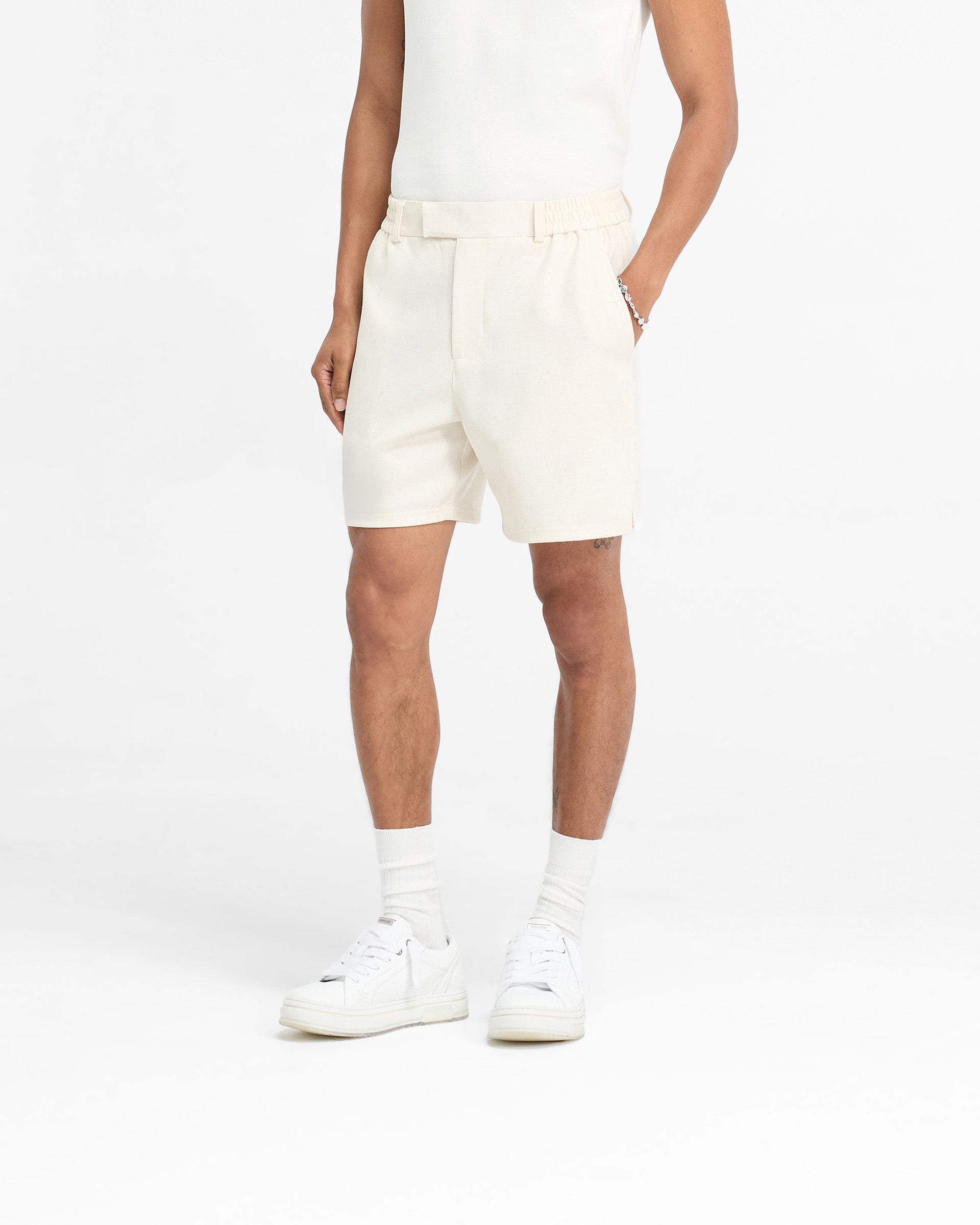 Back product image of mens white shorts on a plain white background | Logo Yacht Short in Antique White | Linen blend shorts with hybrid waistband and side split hem | FW24 Shorts | Represent Clo