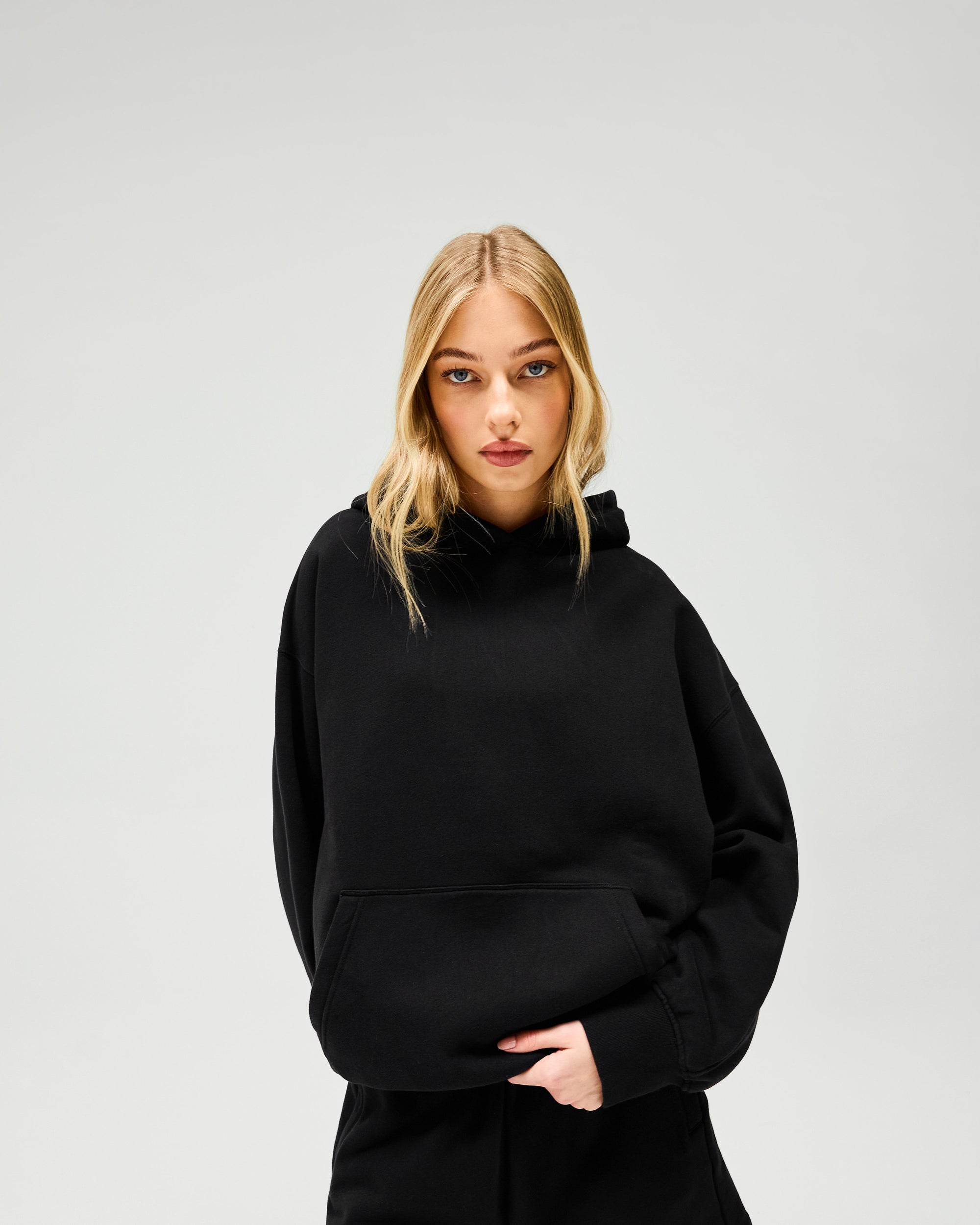 Back product image of a womens black hoodie on a plain white background | Owners Club Boyfriend Hoodie in Jet Black | Relaxed oversized fit hoodie with ribbed hem and cuffs | Womens Owners Club Hoodies | Represent Clo