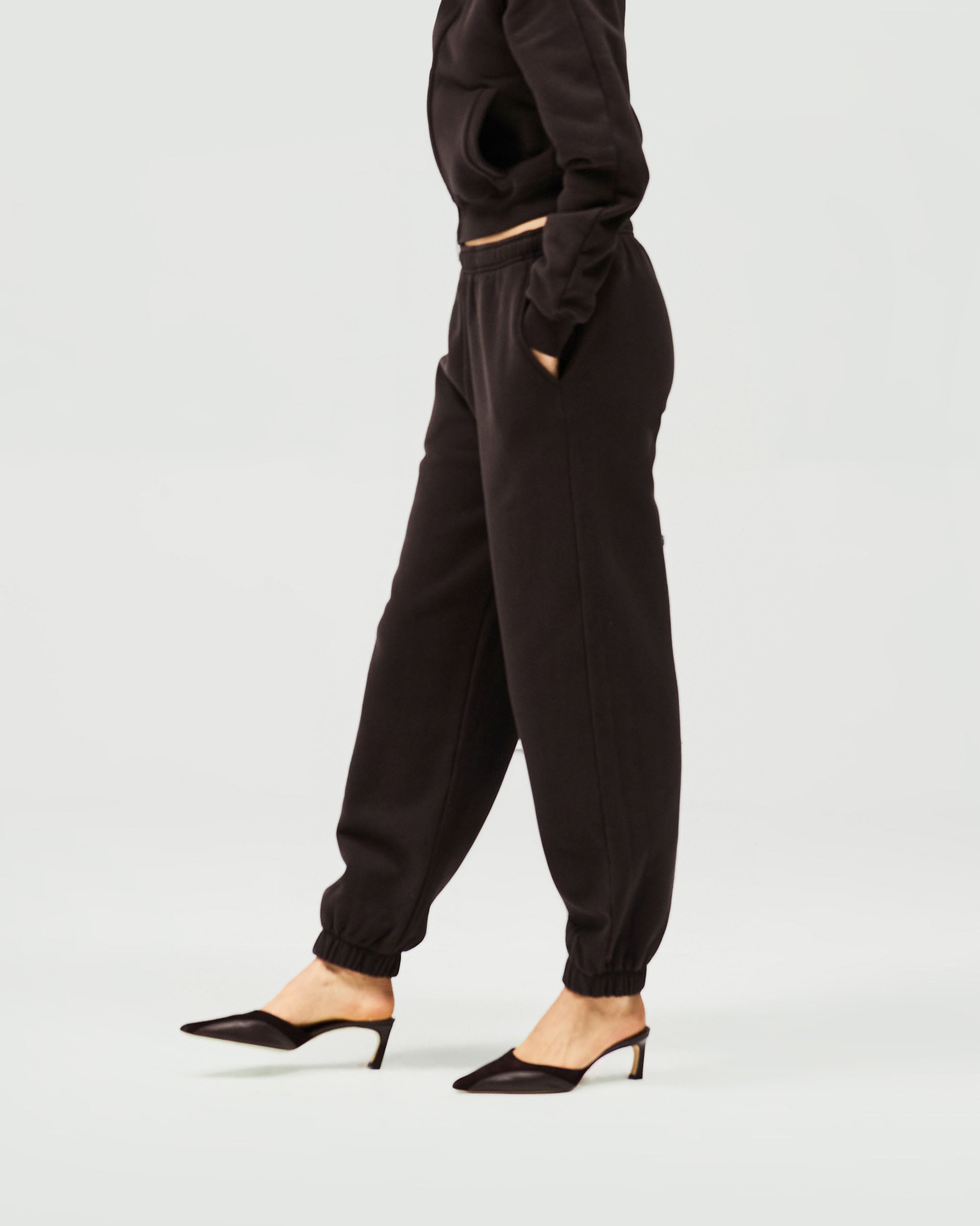 Back product image of a womens brown track pant on a plain white background | Owners Club Track Pant in Black Coffee | Track pants with elasticised waist and leg hems | Womens Owners Club Bottoms | Represent Clo