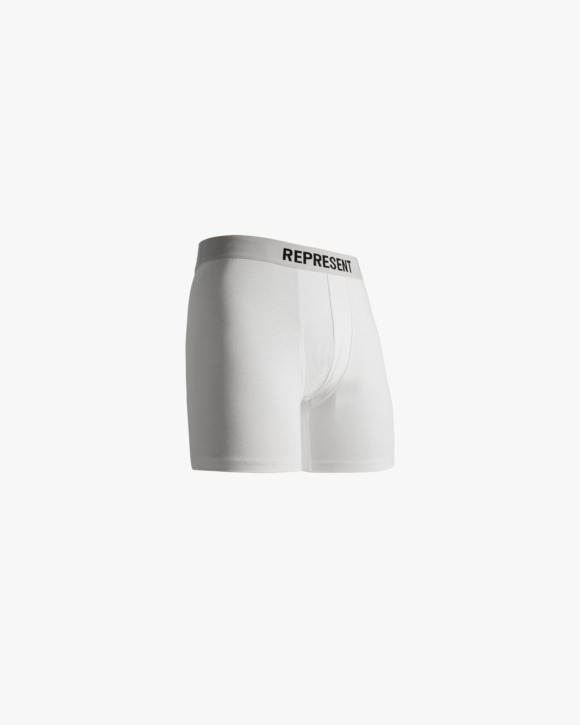 Man wearing white boxers | Represent Boxers 2 Pack in Flat White | White boxers with elastic waistband and medium rise waist | FW22 Accessories | Represent Clo