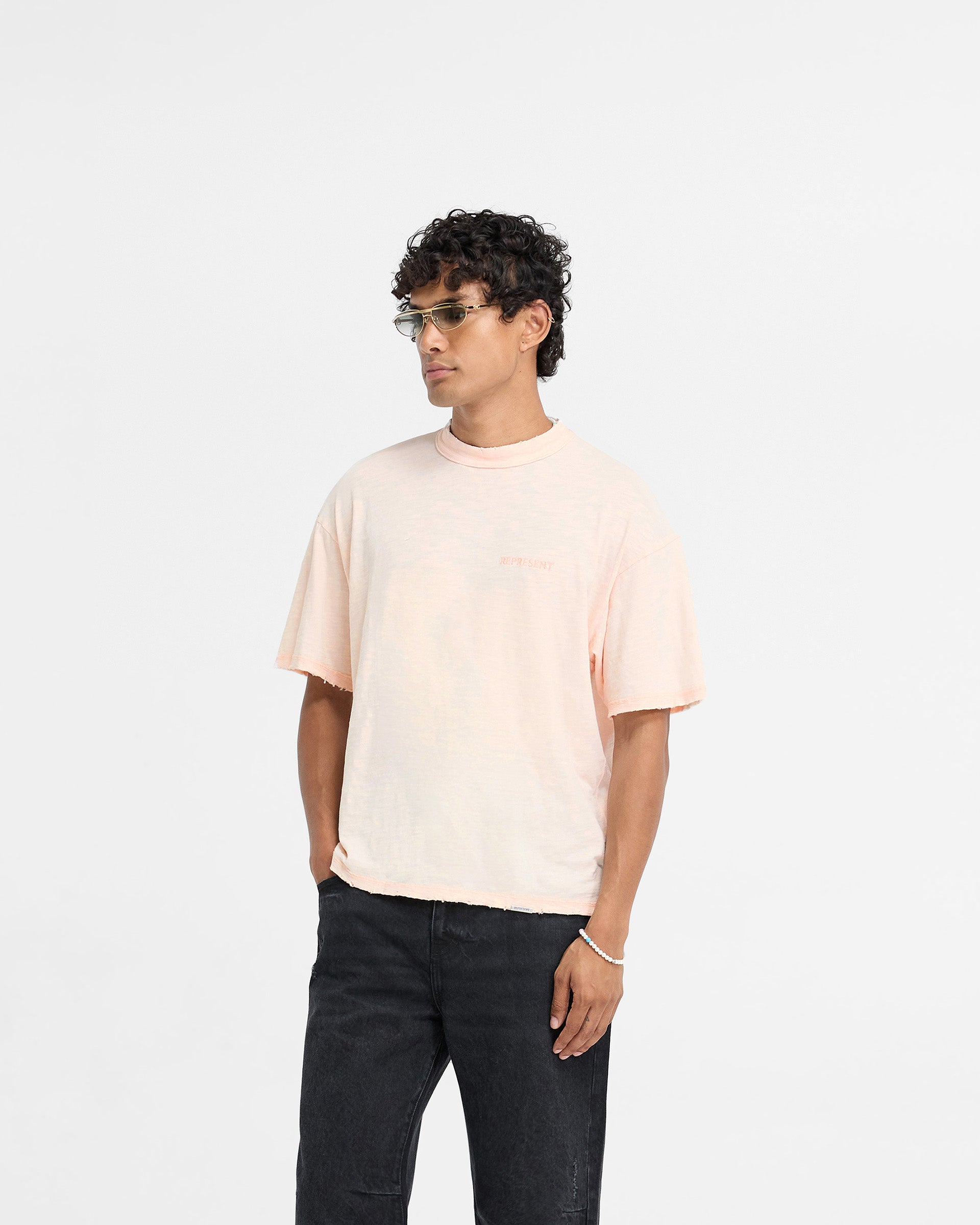 Back product image of a mens coral t-shirt on a plain white background | Slub T-Shirt in Washed Coral | Slightly oversized t-shirt with tonal embroidery | FW24 T-Shirts | Represent Clo