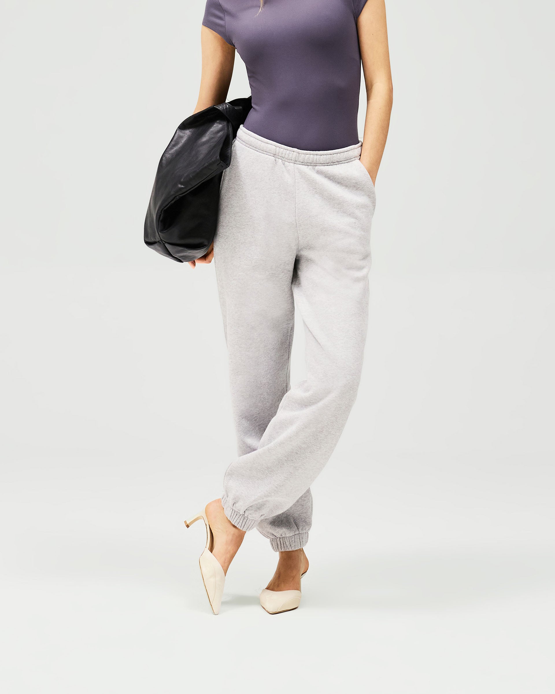 Back product image of a womens grey track pant on a plain white background | Owners Club Track Pant in Grey Marl | Sweatpant with elasticised waist and cuffs | Womens Owners Club Bottoms | Represent Clo