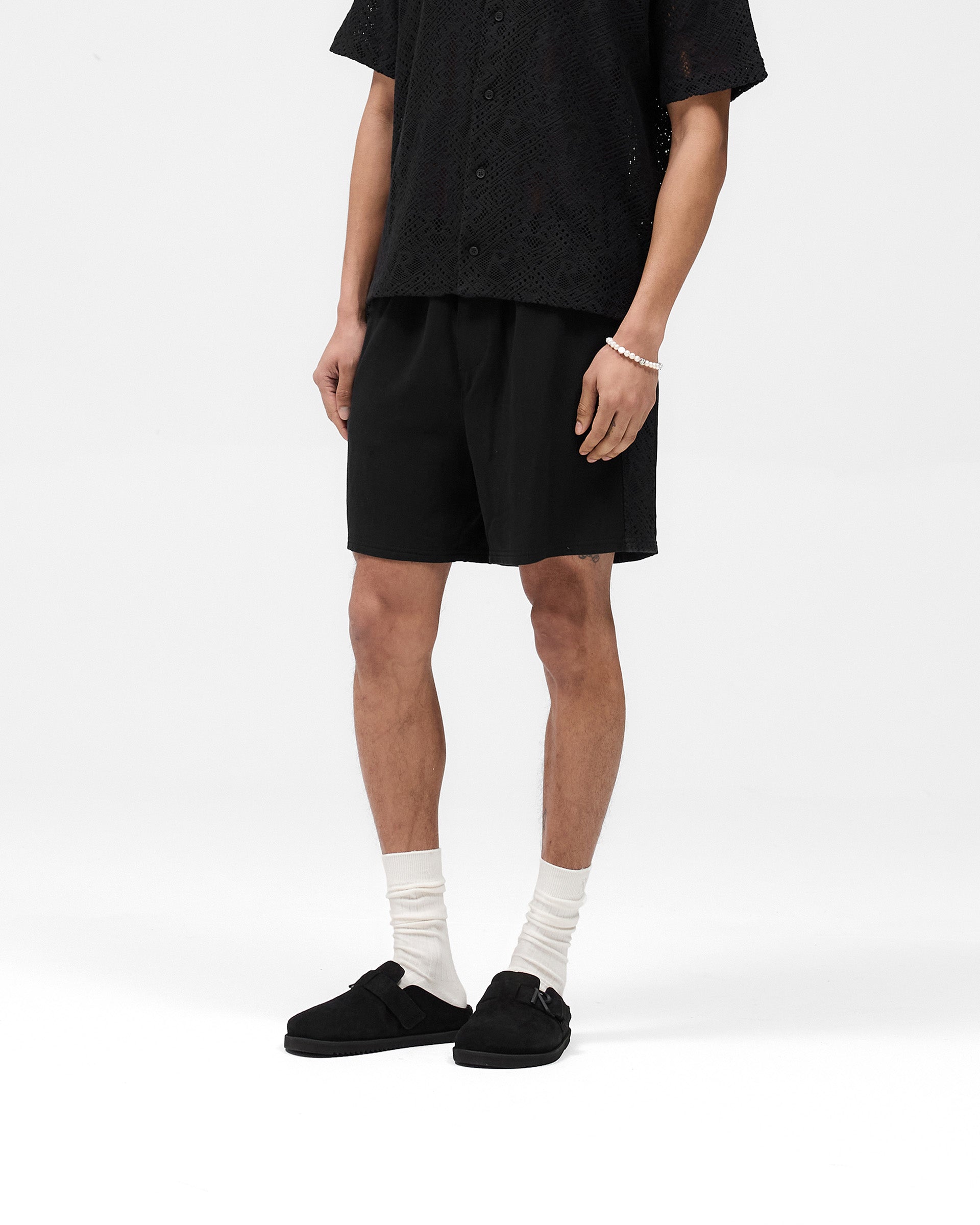 Back product image of mens black shorts on a plain white background | Knitted Panel Short in Black | Shorts with knitted panel detailing and elasticated waistband | SS25 Shorts | Represent Clo