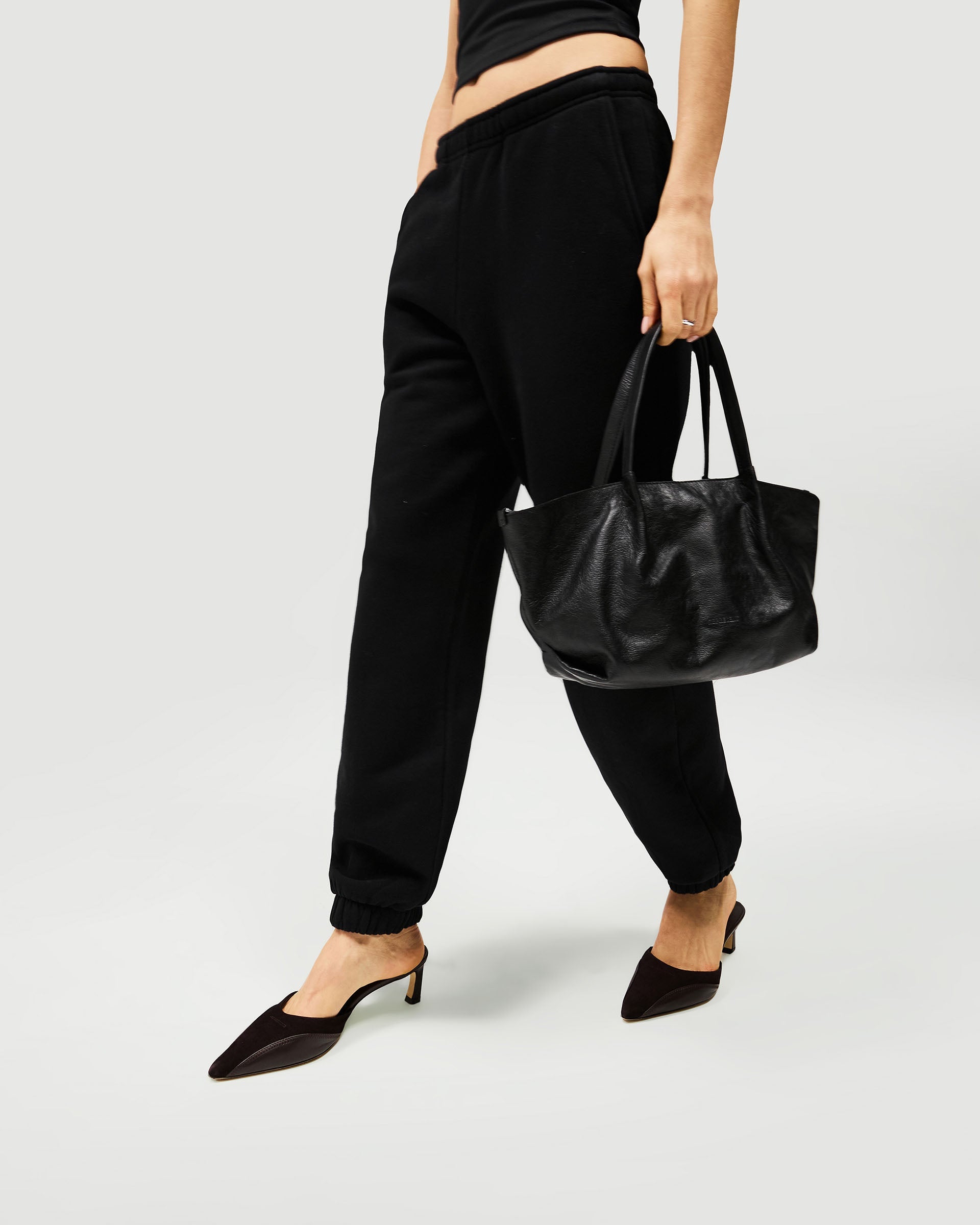 Back product image of womens black track pants on a plain white background | Owners Club Track Pant in Jet Black | Sweatpant with elasticised waist and cuffs | Womens Owners Club Bottoms | Represent Clo
