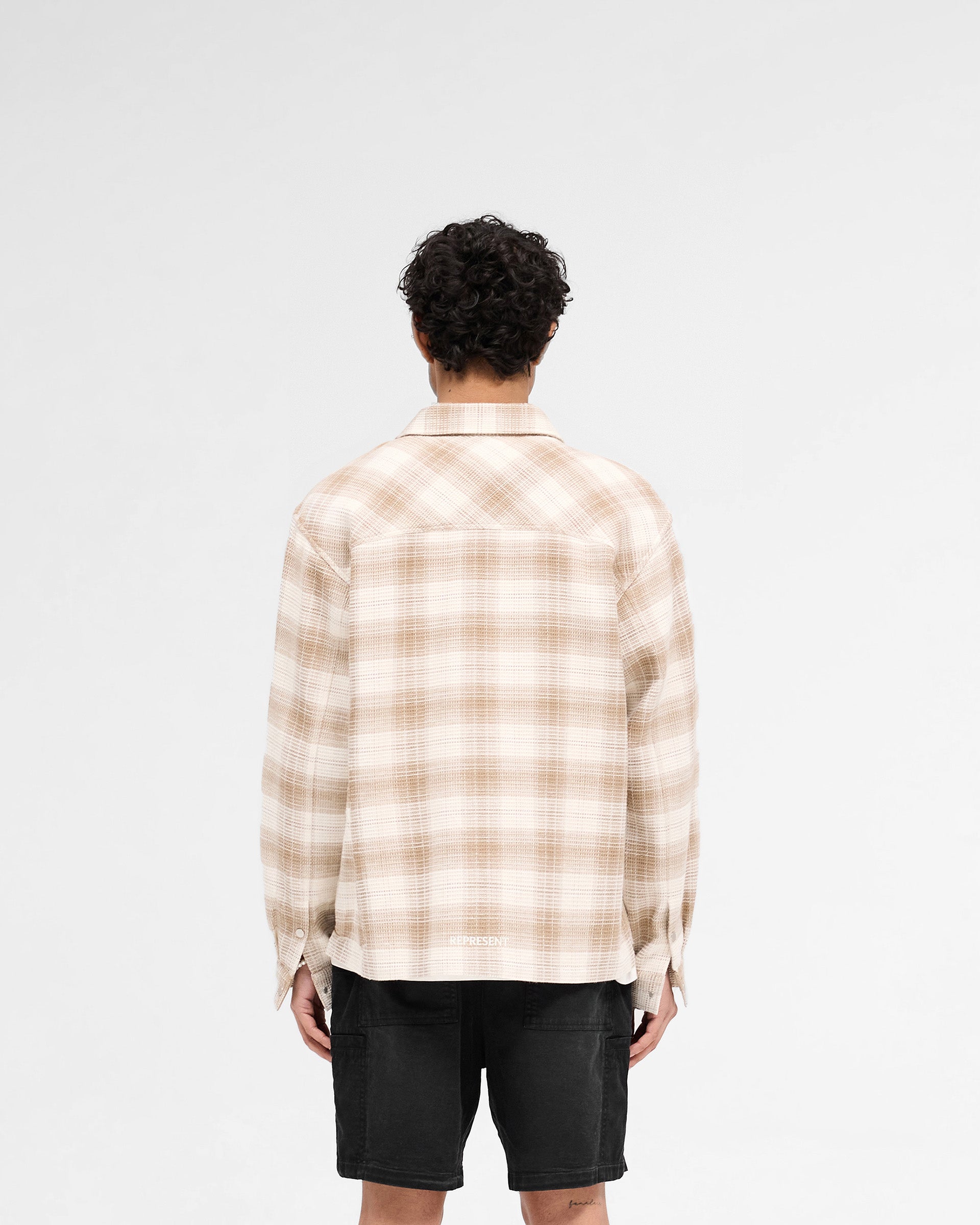 Man wearing a mid brown shirt on a plain white background | Waffle Flannel Shirt in Mid Brown | Waffle fabric shirt with double chest pockets | SS25 Shirts | Represent Clo
