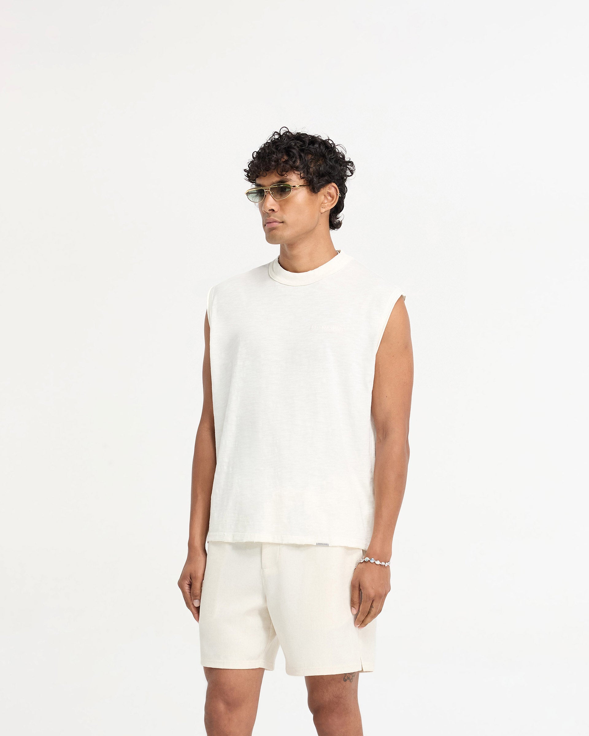 Back product image of a mens white tank top on a plain white background | Slub Tank in Flat White | Oversized tank top with tonal embroidery and distressed details | FW24 T-Shirts | Represent Clo