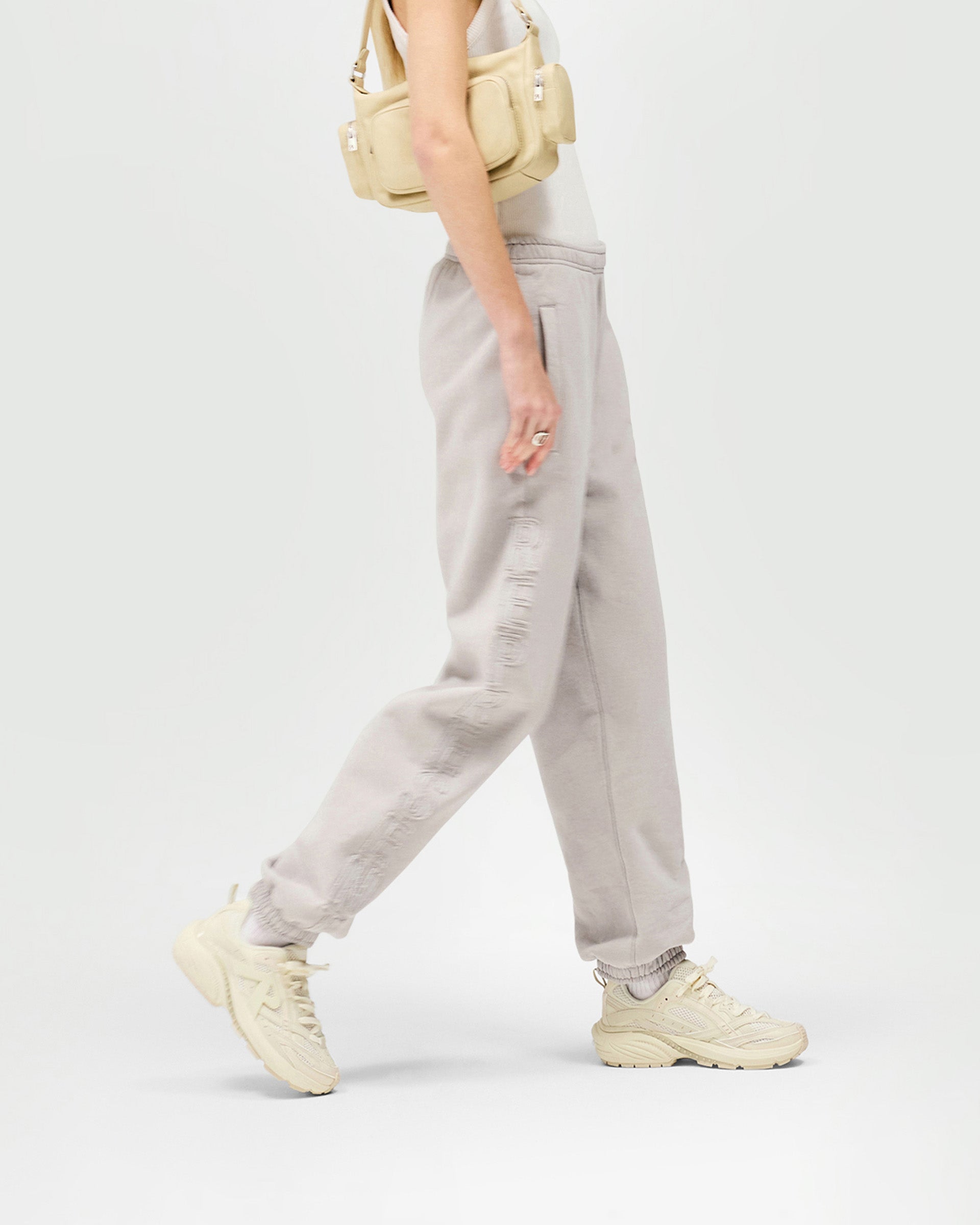 Back product image of womens light grey jogger on a plain white background | Epic Jogger in Light Grey | Joggers with raw edge branding and boyfriend fit | Womens SS25 Bottoms | Represent Clo