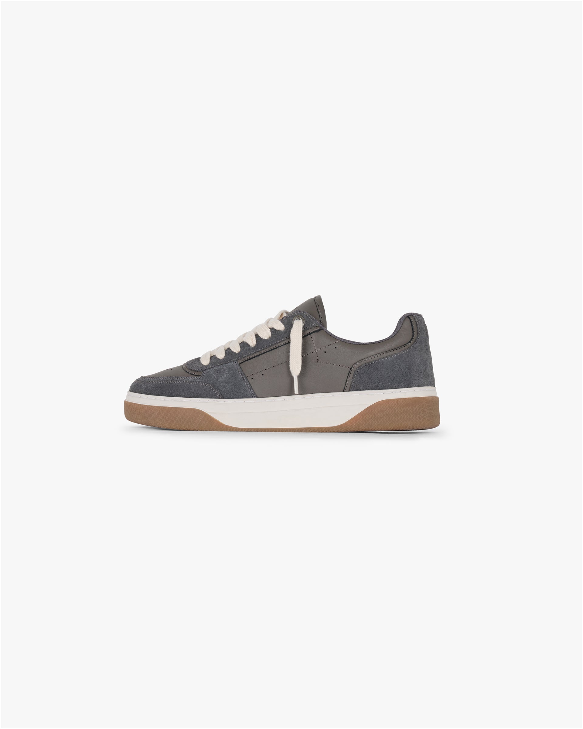 Product shot of a mens dark taupe sneaker on a plain white background | Initial Sneaker in Suede Dark Taupe | Suede and leather footwear with embossed branding | SS25 Footwear | Represent Clo