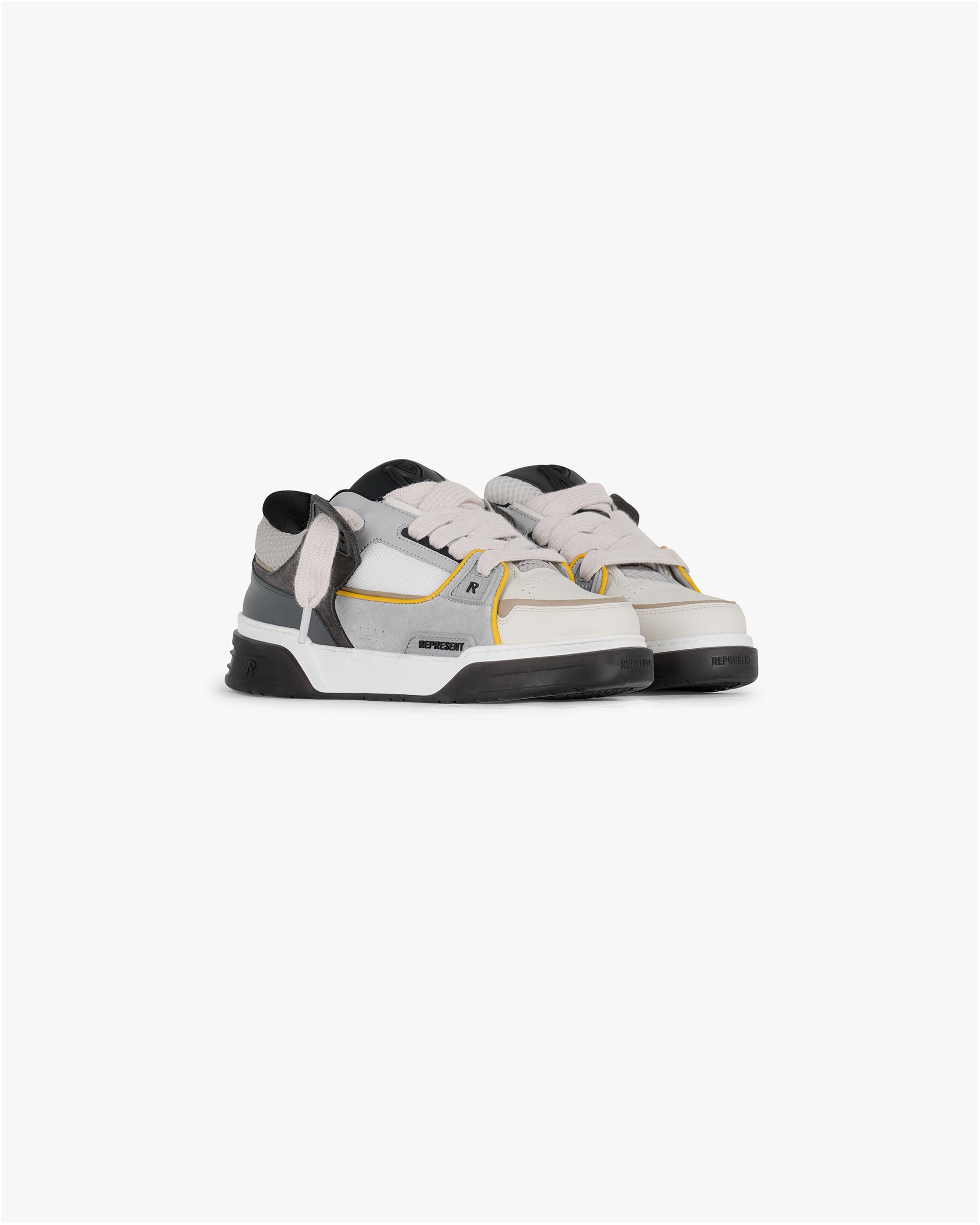 Back product image of mens beige sneakers on a plain white background | Studio Sneaker in Beige Yellow | Suede mix with mesh collar panel and TPU trims | SS25 Footwear | Represent Clo
