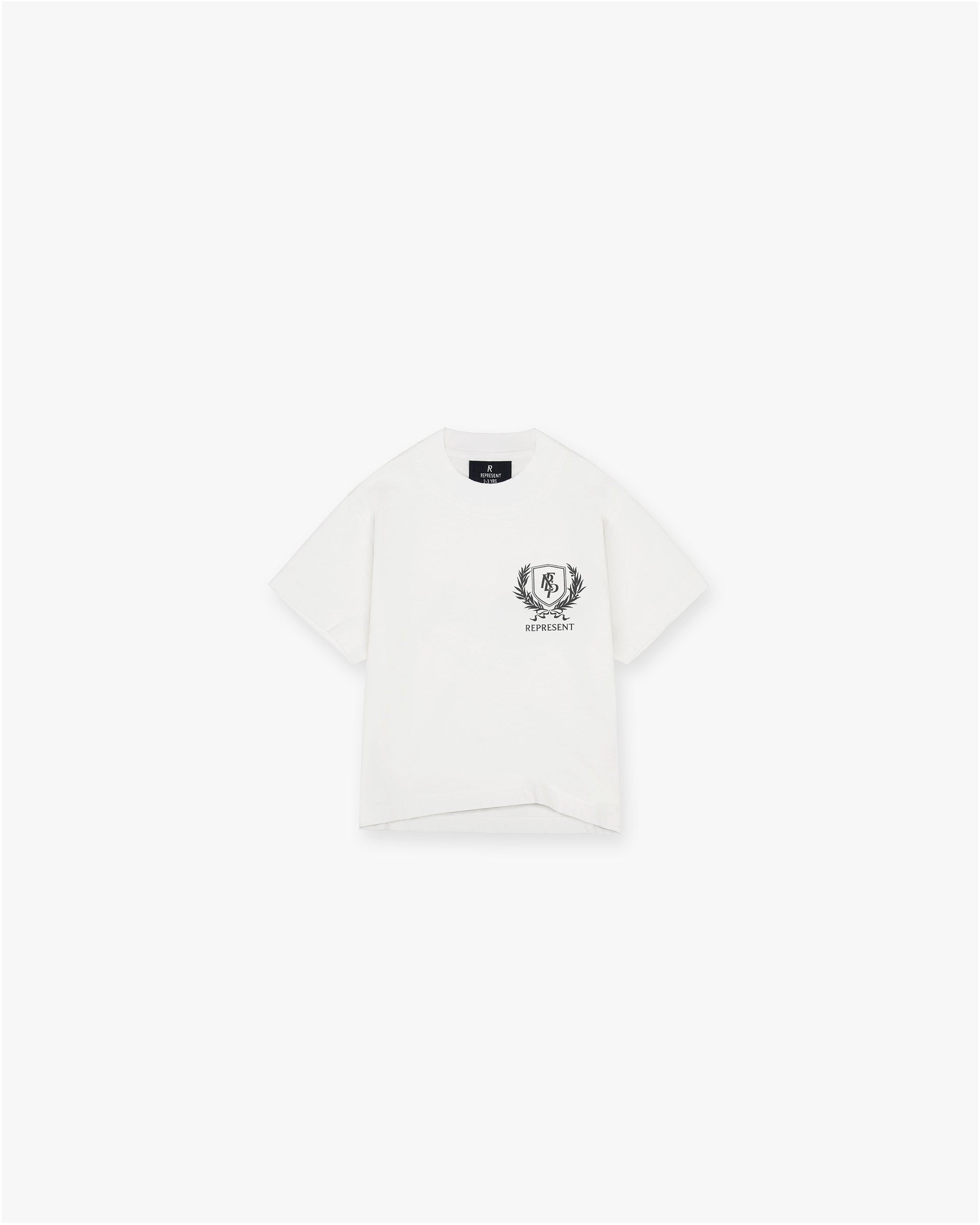 Front product image of a childs white graphic t-shirt on a plain white background | Mini Crest T-Shirt in Flat White | Oversized childs graphic t-shirt with crest print | SS25 T-Shirts | Represent Clo