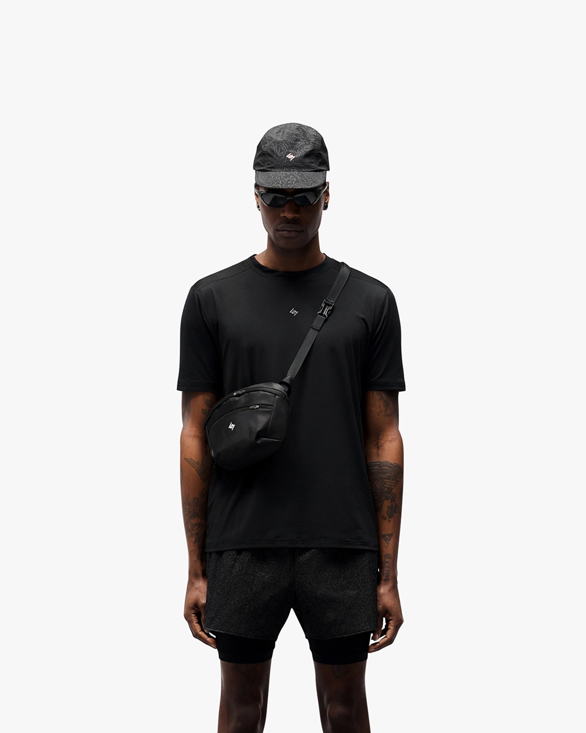 Man wearing a black t-shirt on a plain white background | 247 Contour Run T-Shirt in Black | Breathable and sweat-wicking running t-shirt | 247 T-Shirts | Represent Clo