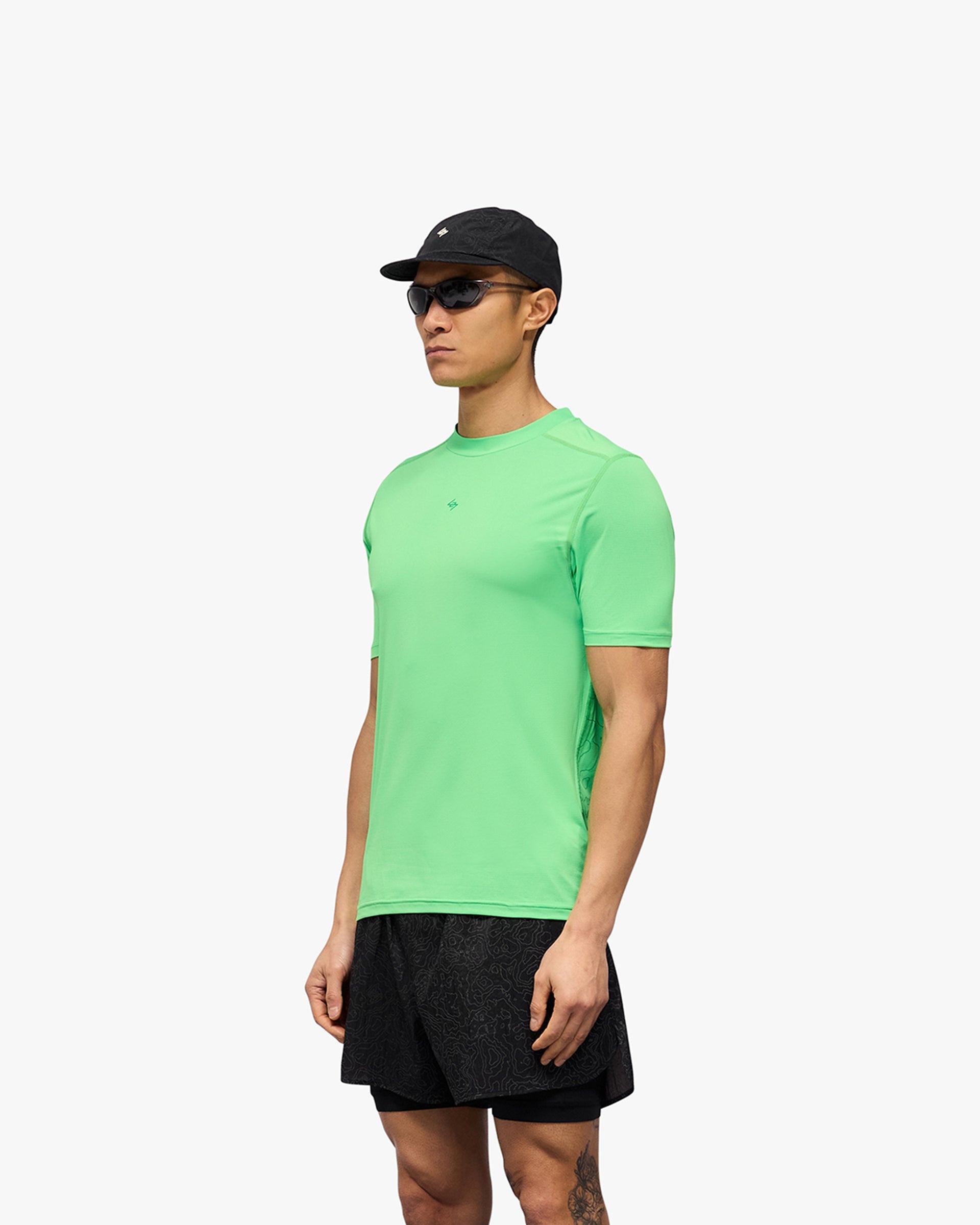Man wearing a green t-shirt on a plain white background | 247 Contour Run T-Shirt in Speed Green | Breathable mesh running t-shirt with antibacterial finish | 247 T-Shirts | Represent Clo