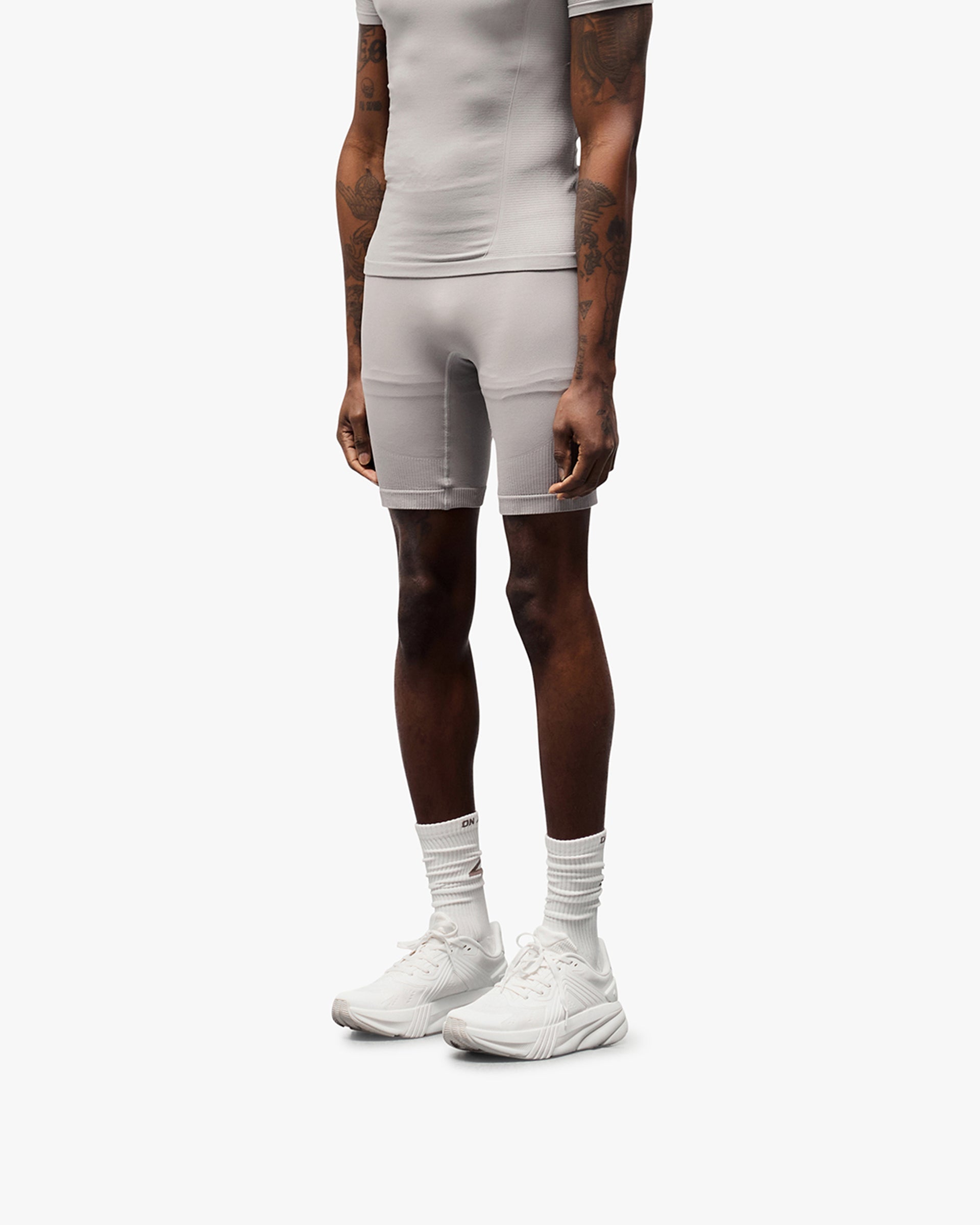 Back product image of mens grey shorts on a plain white background | 247 DNA Seamless Shorts in Titanium | Seamless shorts with flatlock stitching and compression support | 247 Shorts | Represent Clo