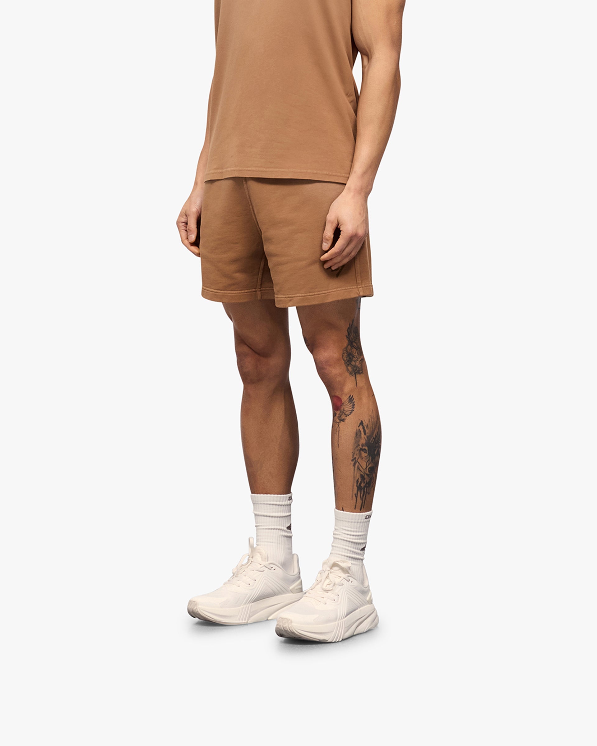 Back product image of mens rust shorts on a plain white background | 247 Motion Shorts in Rust | Jersey shorts with elasticated waistband | 247 Shorts | Represent Clo