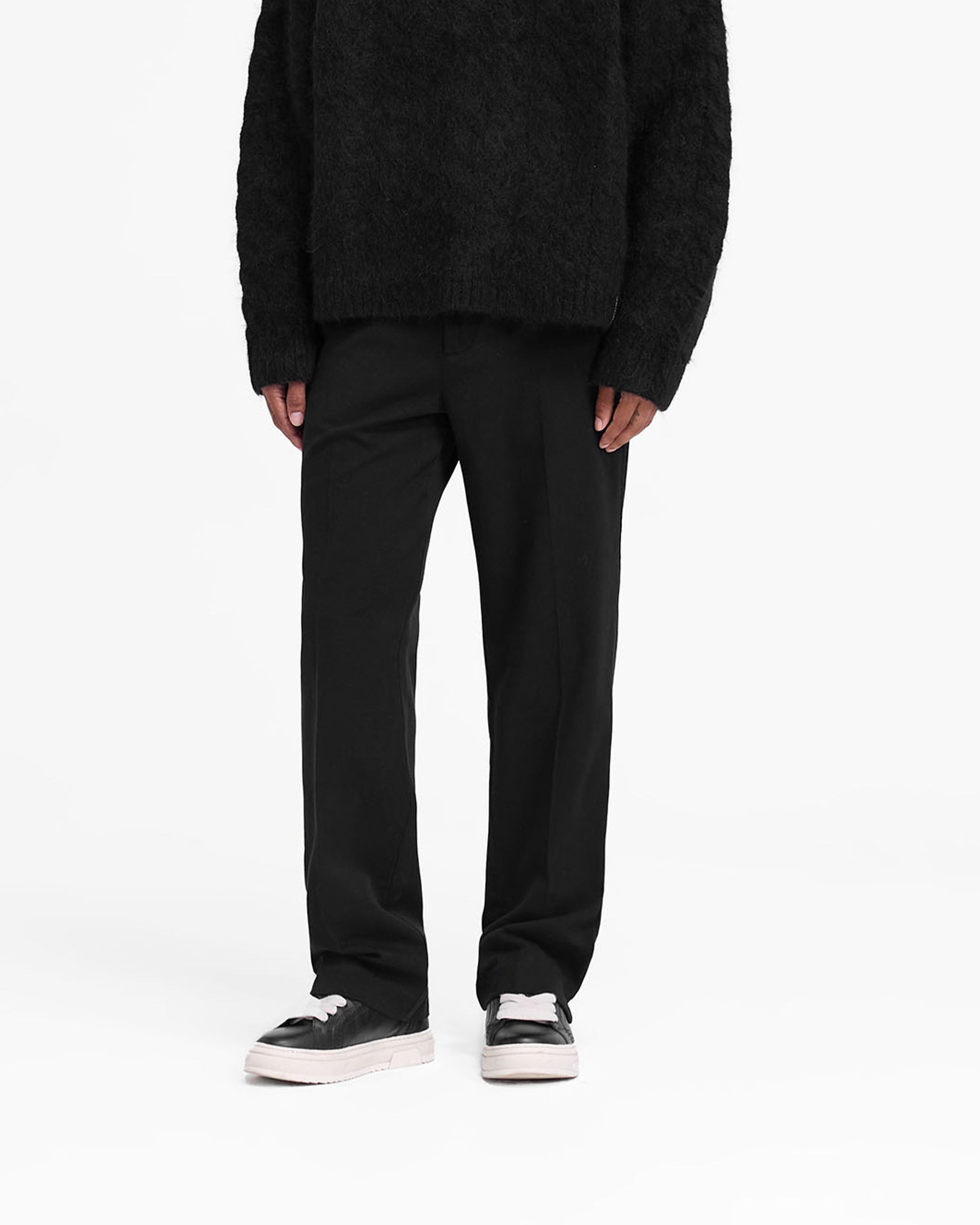 Back product image of a mens black pants on a plain white background | Cotton Pant in Black | Black pants with back yoke and small side split hem | FW24 Pants | Represent Clo