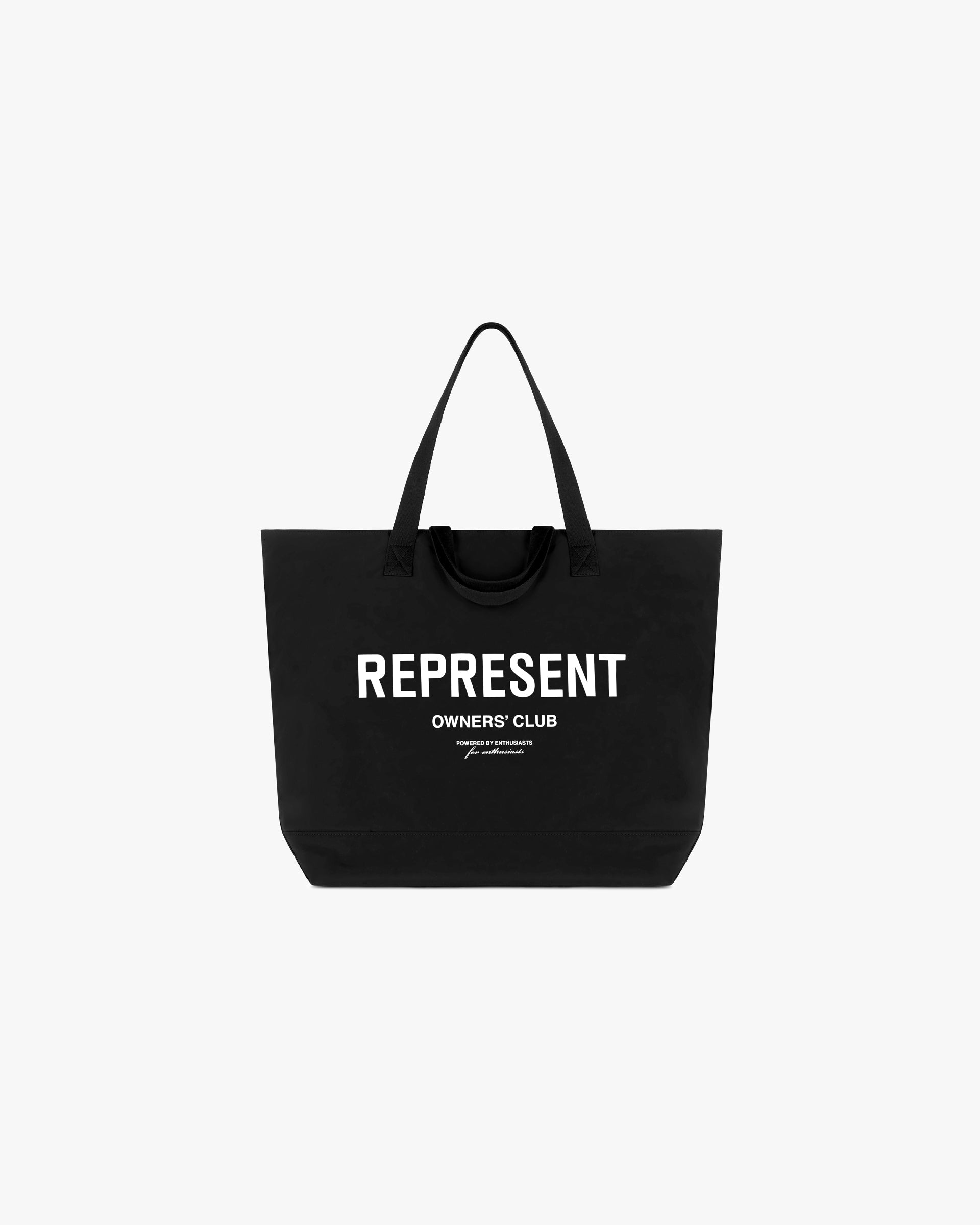 Front product image of a black woven tote bag on a plain white background | Represent Owners Club Woven Tote Bag in Black | Durable accessory with ample storage | Owners Club Accessories | Represent Clo