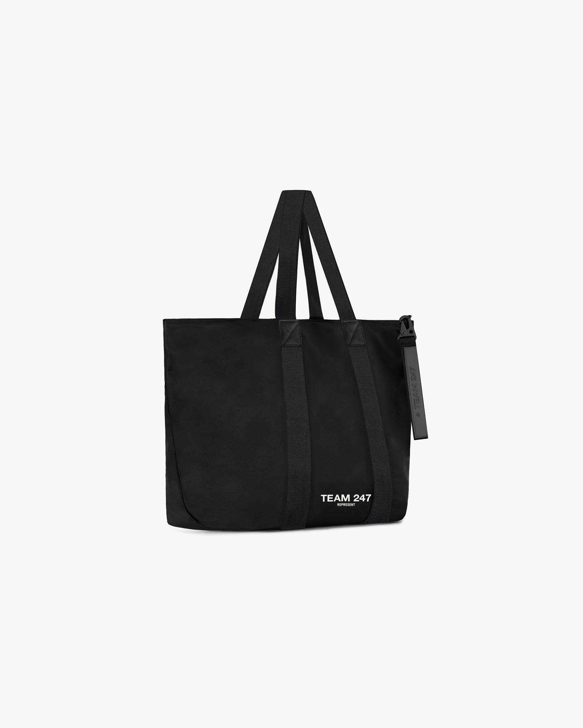 Back product image of a mens black tote bag on a plain white background | Team 247 Tote Bag in Black | Tote bag with rubberised hardware and internal zip pocket | 247 Accessories | Represent Clo