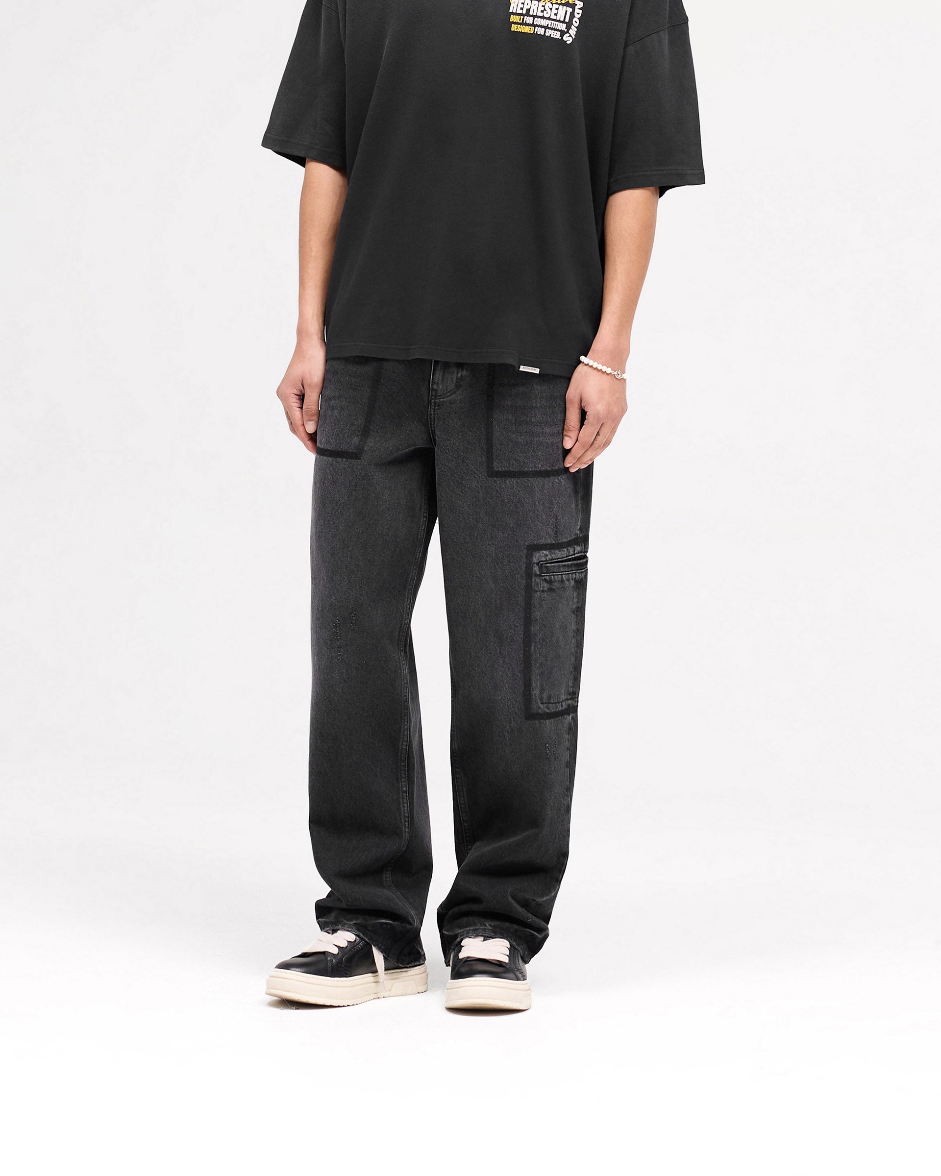 Back product image of mens black denim jeans on a plain white background | R3 Drive Denim in Jet Black | Baggy fit with distressed detailing | SS25 Denim | Represent Clo