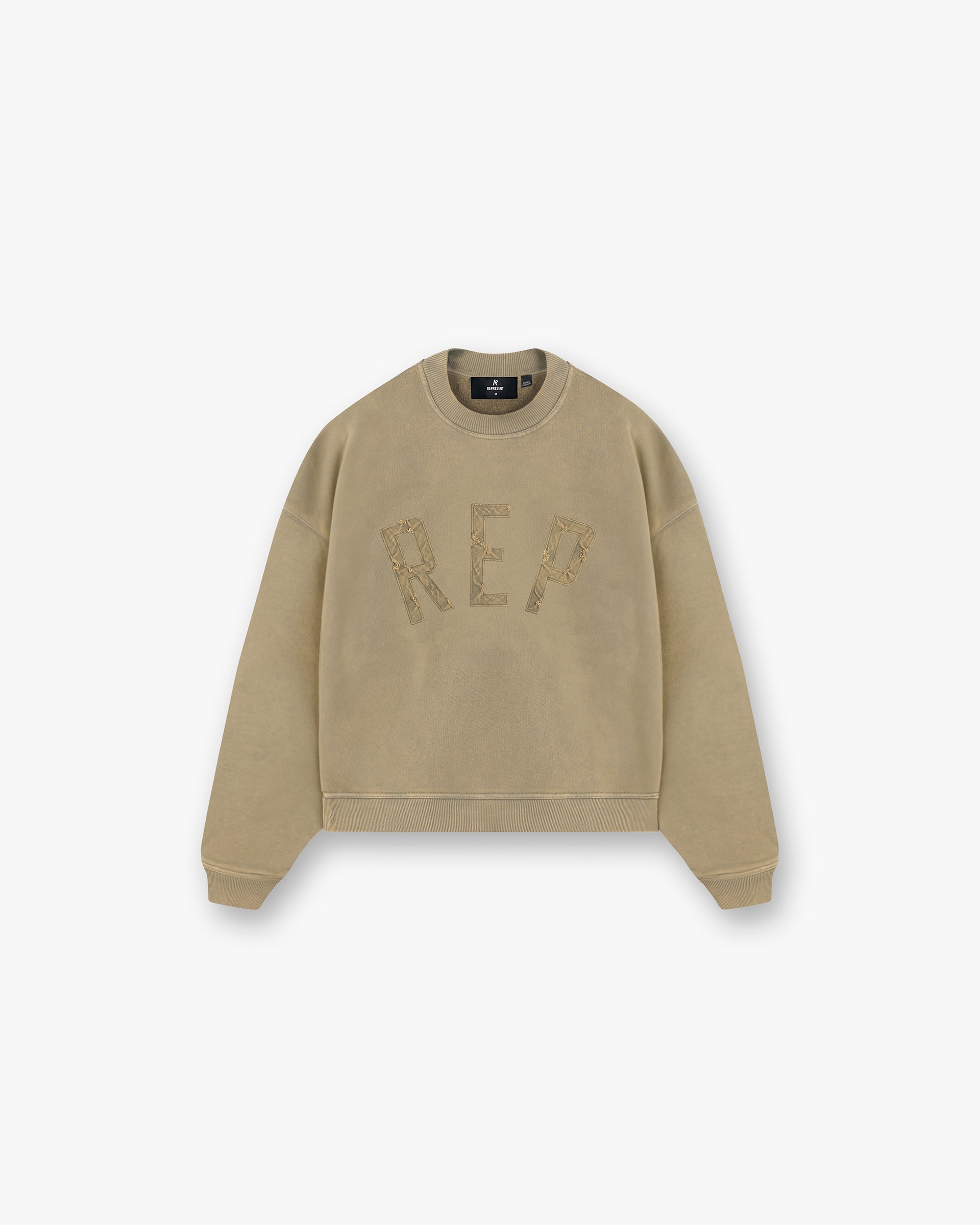 Front product image of a mens fawn sweater on a plain white background | Rep Applique Sweater in Fawn | Cotton sweaters with distressed details | FW24 Sweaters | Represent Clo
