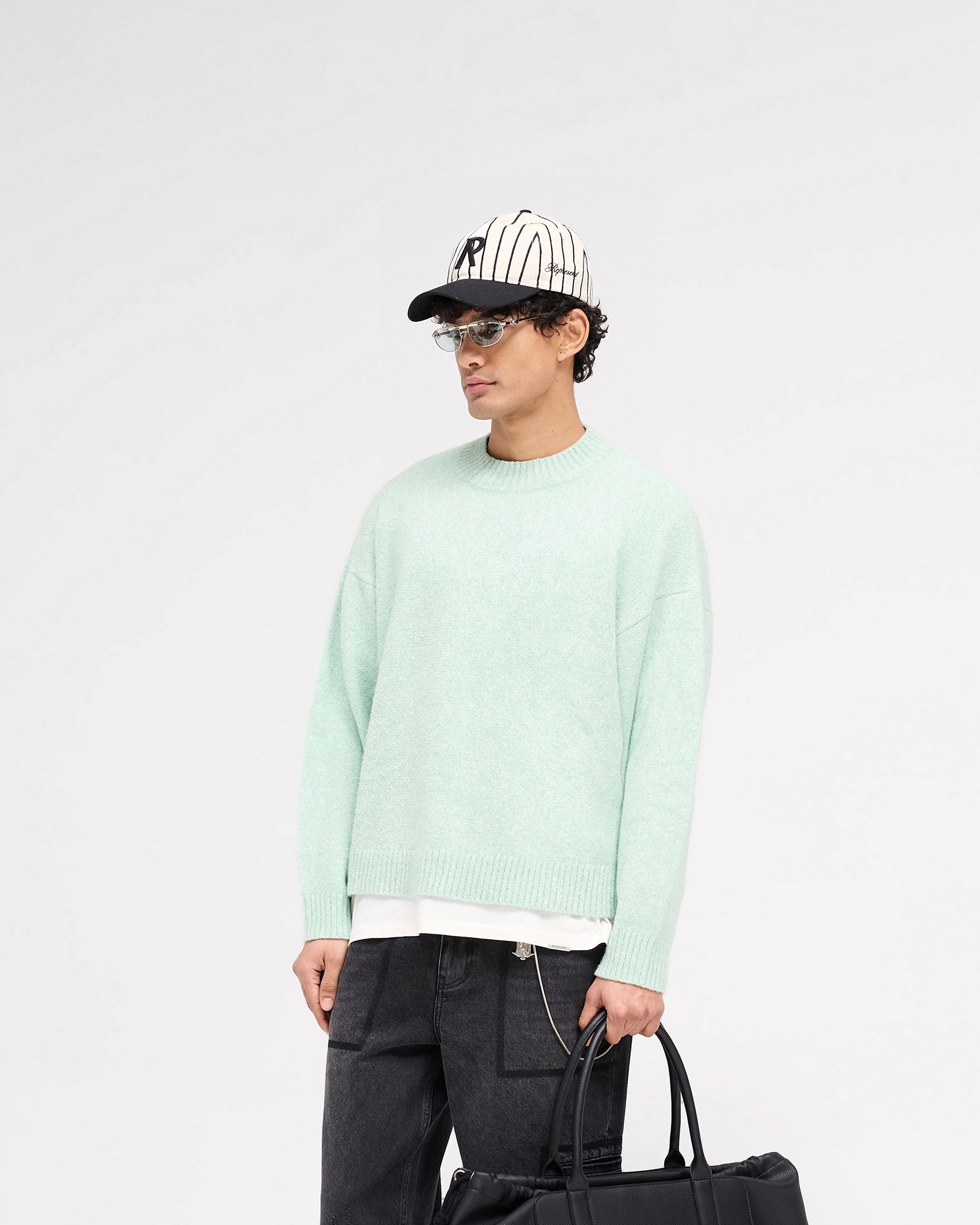 Back product image of a mens green knit jumper on a plain white background | Marled Knit Jumper in Matcha | Knitwear with ribbed collar, cuffs, and hem | SS25 Knitwear | Represent Clo
