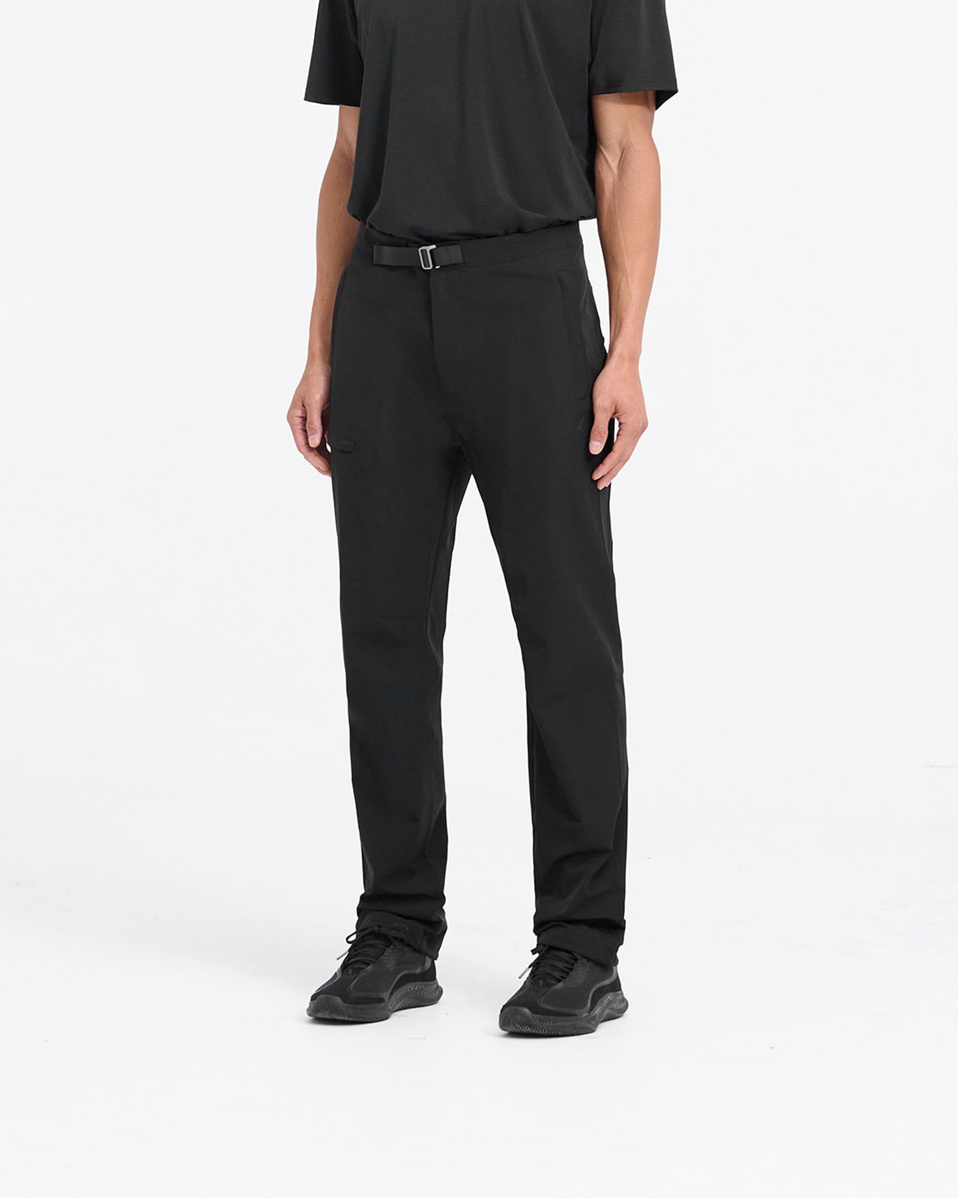 Back product image of mens black pants on a plain white background | 247 Mission Pant in Black | Stretch nylon pants with zip pockets and built-in belt | 247 Pants | Represent Clo