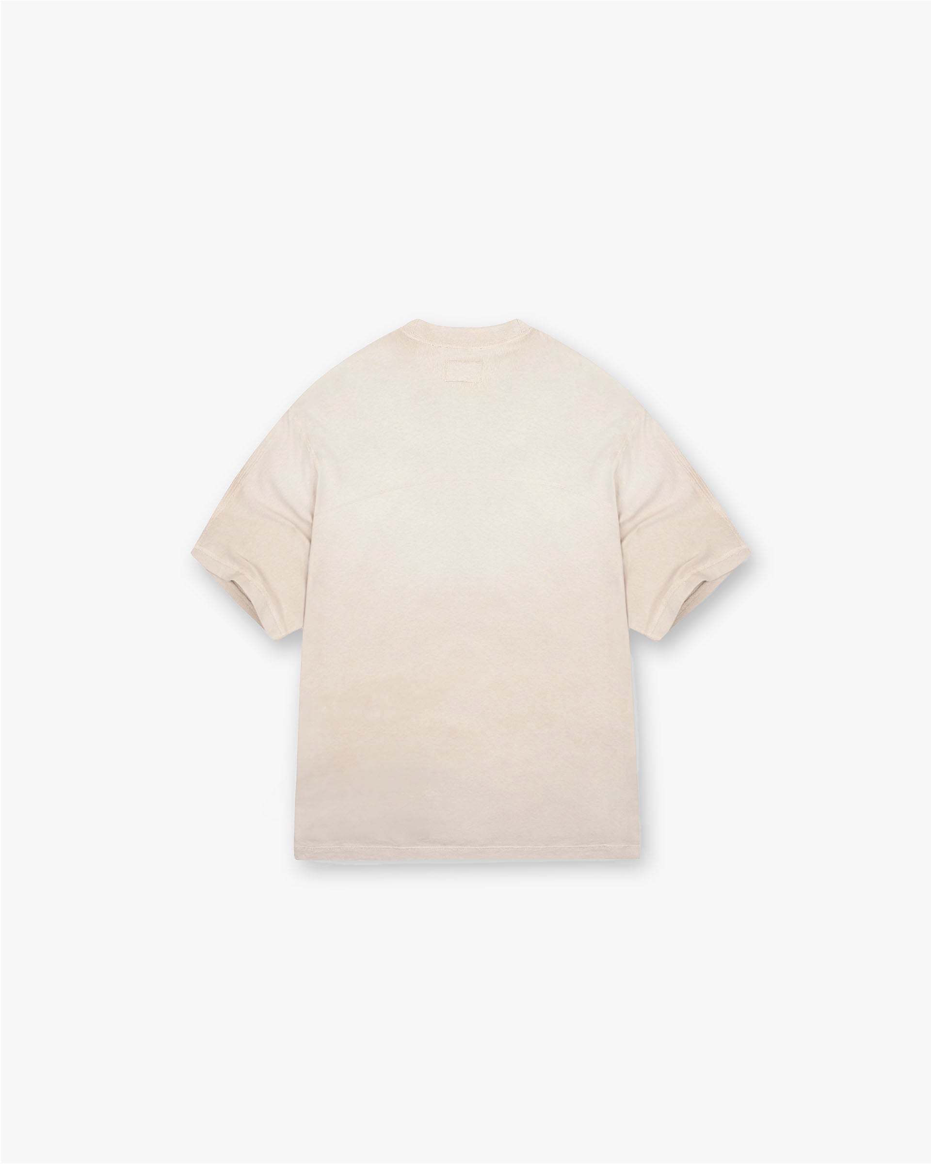 Back product image of a mens beige t-shirt on a plain white background | Stepped Hem T-Shirt in Oat | Boxy fit t-shirt with split stepped hem | FW24 T-Shirts | Represent Clo