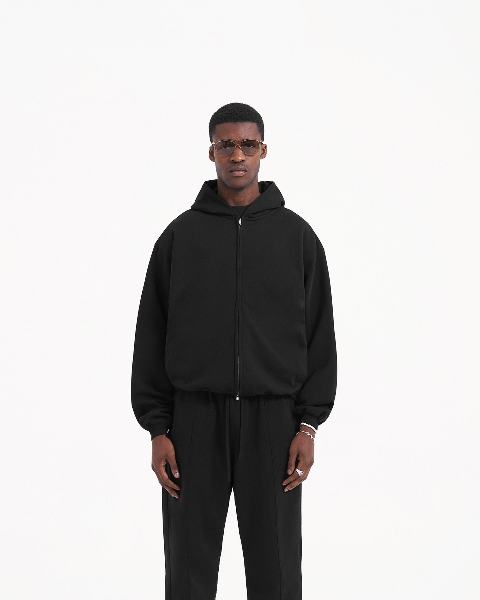 Back product image of a mens black hoodie on a plain white background | Initial Zip Hoodie in Jet Black | Boxy fit zip hoodie with welt pockets | Initial Hoodies | Represent Clo