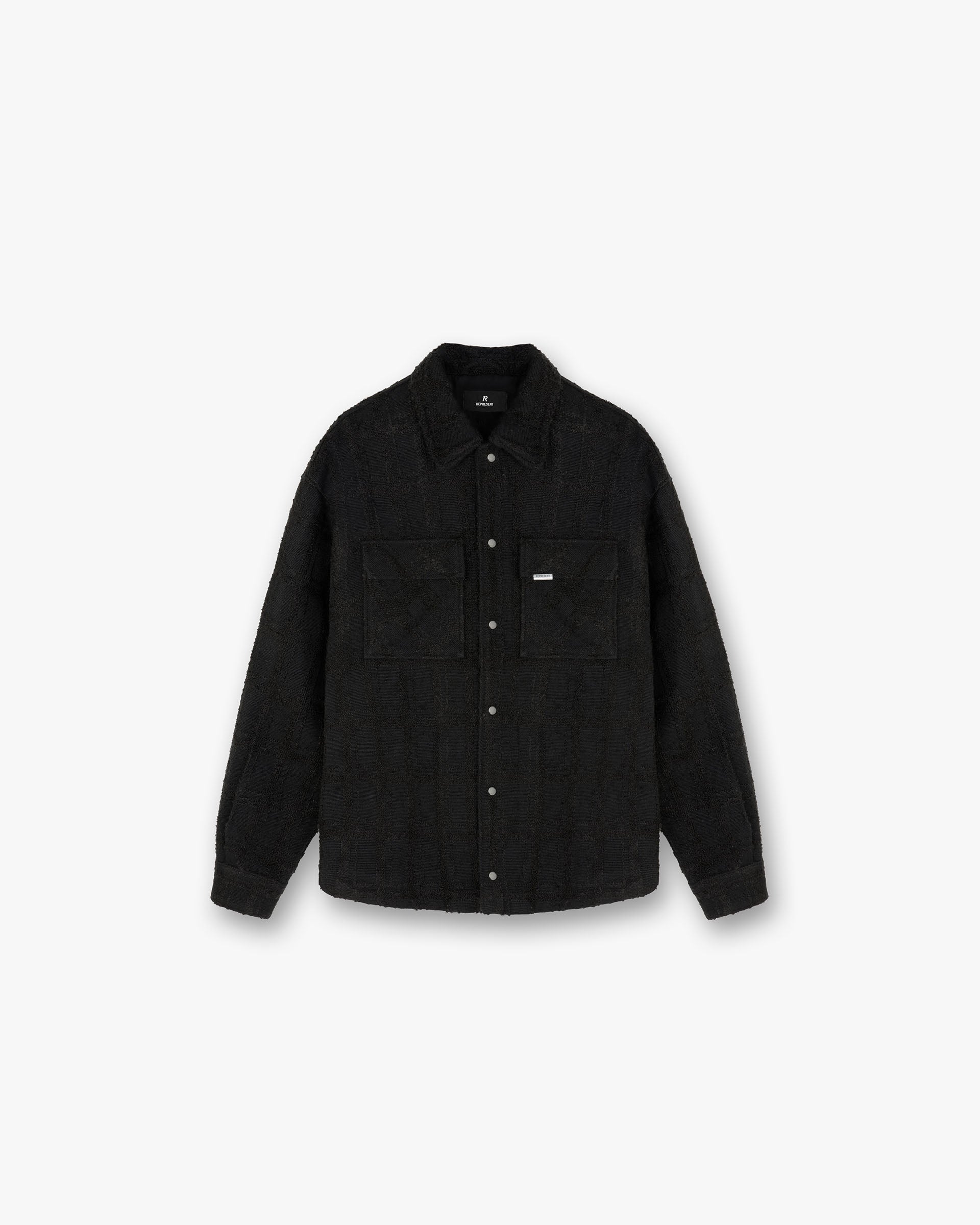 Front product image of a mens black overshirt on a plain white background | Wadded Overshirt in Black | Overshirt with puff print graphic detailing | FW24 Shirts | Represent Clo