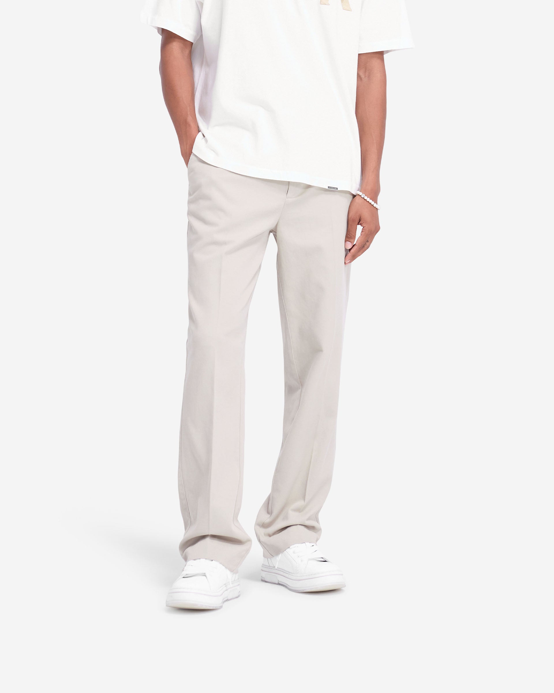 Back product image of mens stone pants on a plain white background | Cotton Pant in Stone | Straight leg pants with side and back pockets | FW24 Pants | Represent Clo