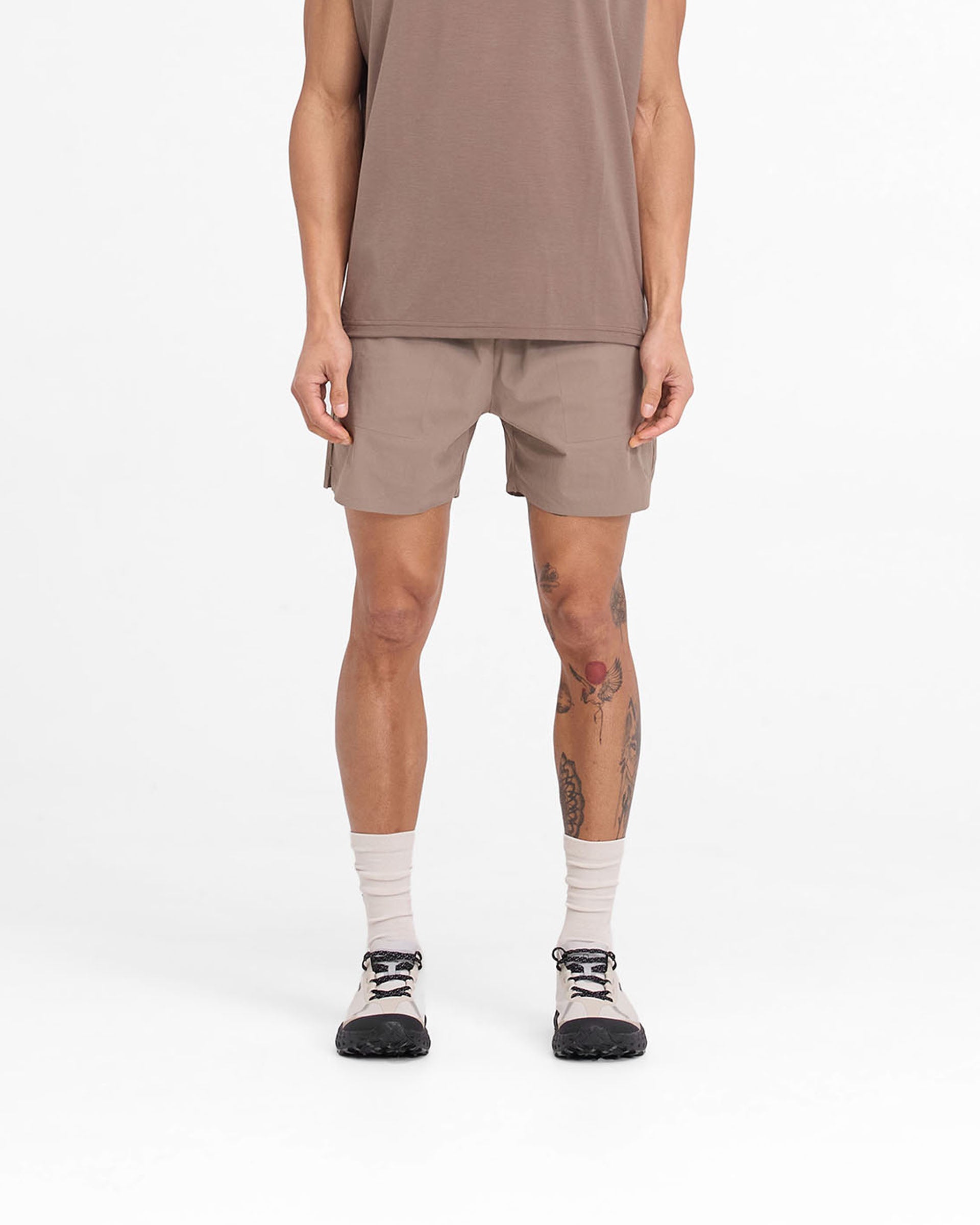 Man wearing mens umber shorts on a plain white background | Team 247 Fused Shorts in Umber | Shorts with branded waistband and 4-way stretch | 247 Shorts | Represent Clo