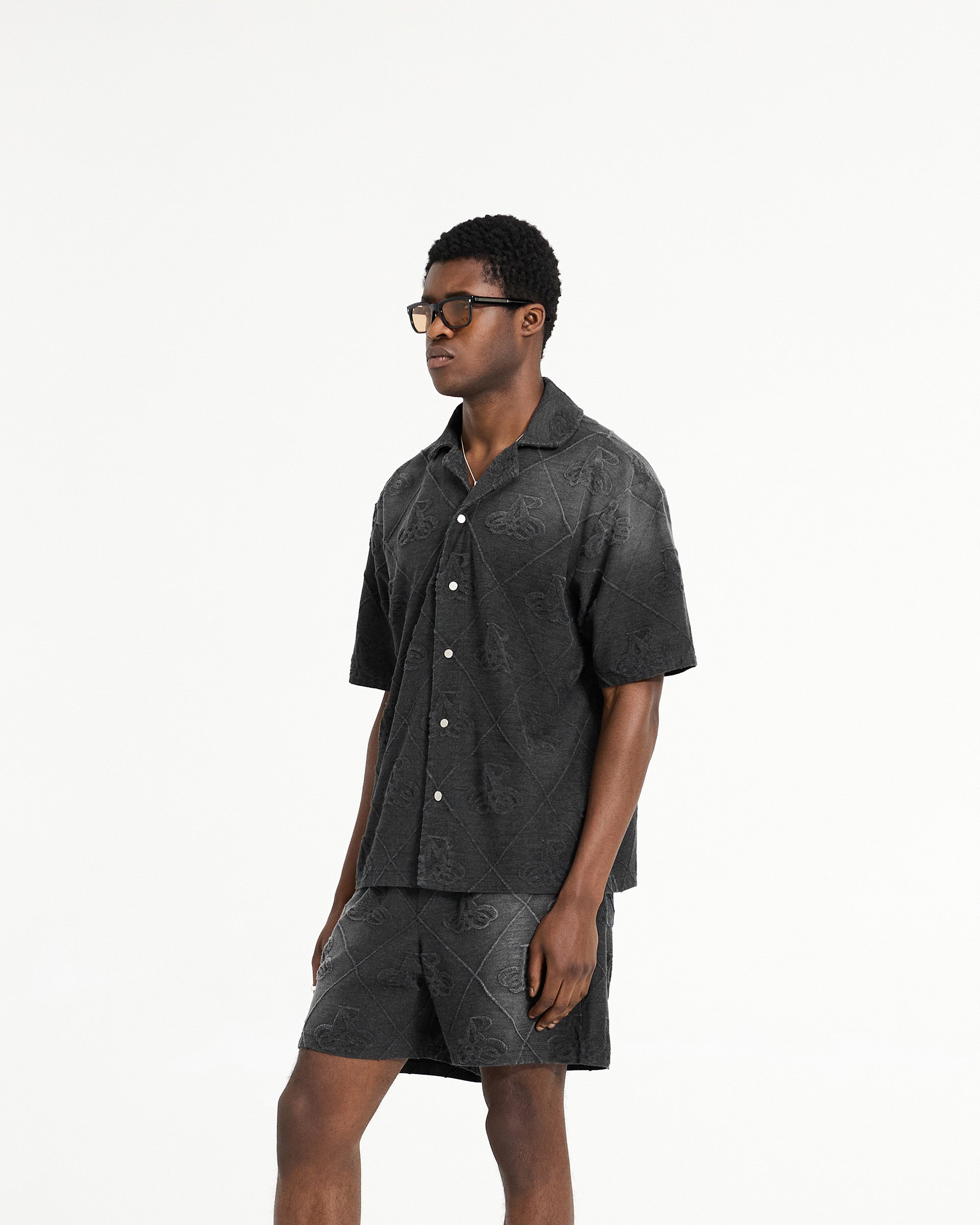 Back product image of a mens black shirt on a plain white background | Towelling Shirt in Jet Black | Oversized fit shirt with popper fastenings | SC24 Shirts | Represent Clo