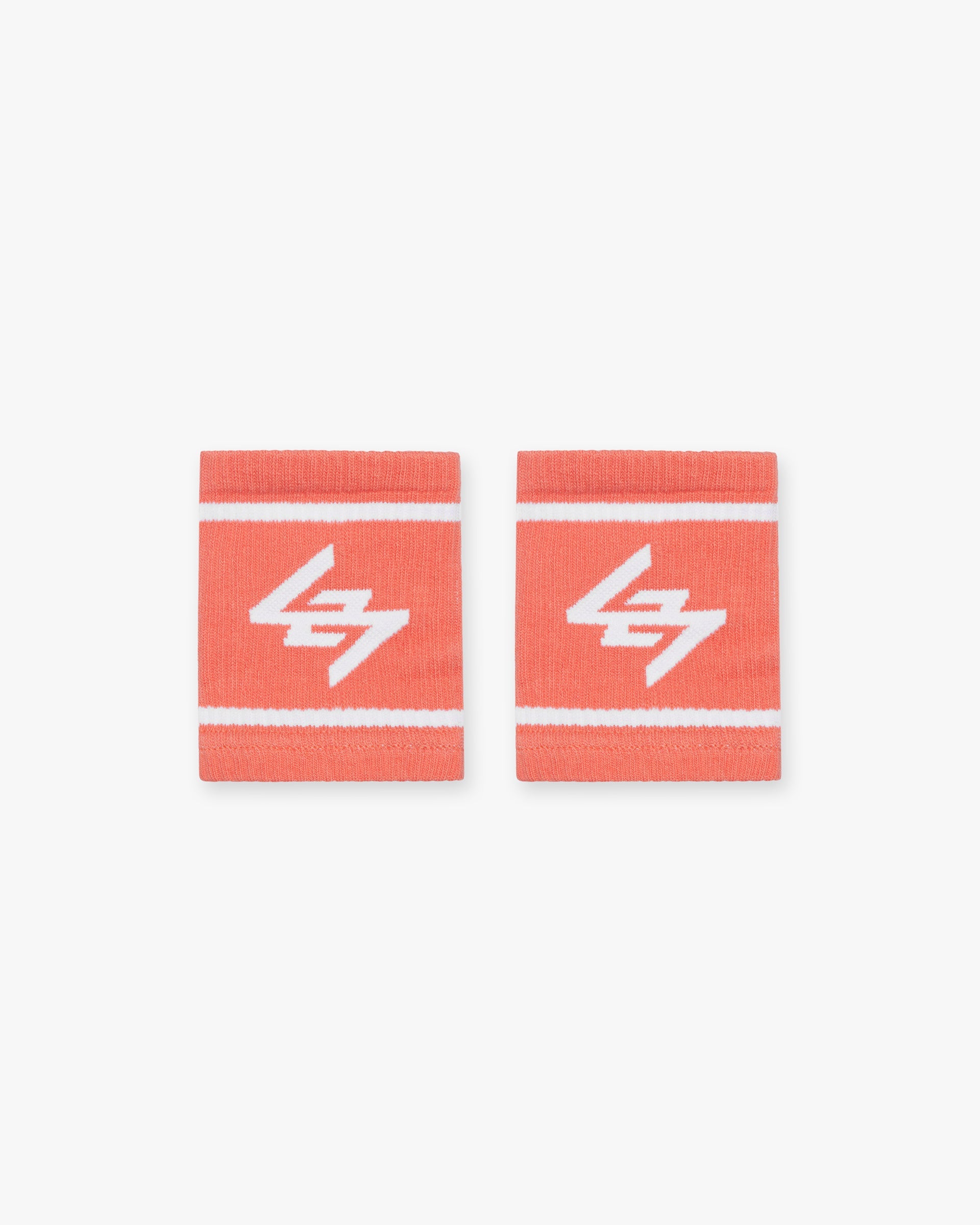 Front product image of mens coral wrist bands on a plain white background | 247 Logo Wrist Bands in Coral | Stretchy accessory bands | 247 Accessories | Represent Clo