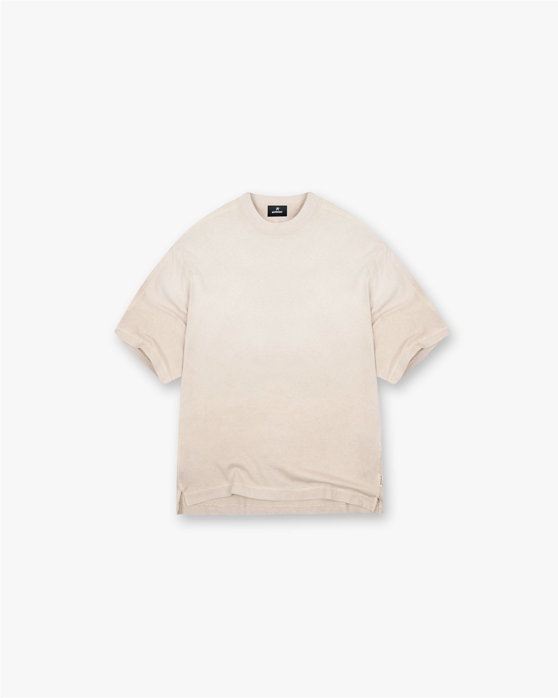 Front product image of a mens oat t-shirt on a plain white background | Stepped Hem T-Shirt in Oat | T-shirt with stepped hem design | FW24 T-Shirts | Represent Clo