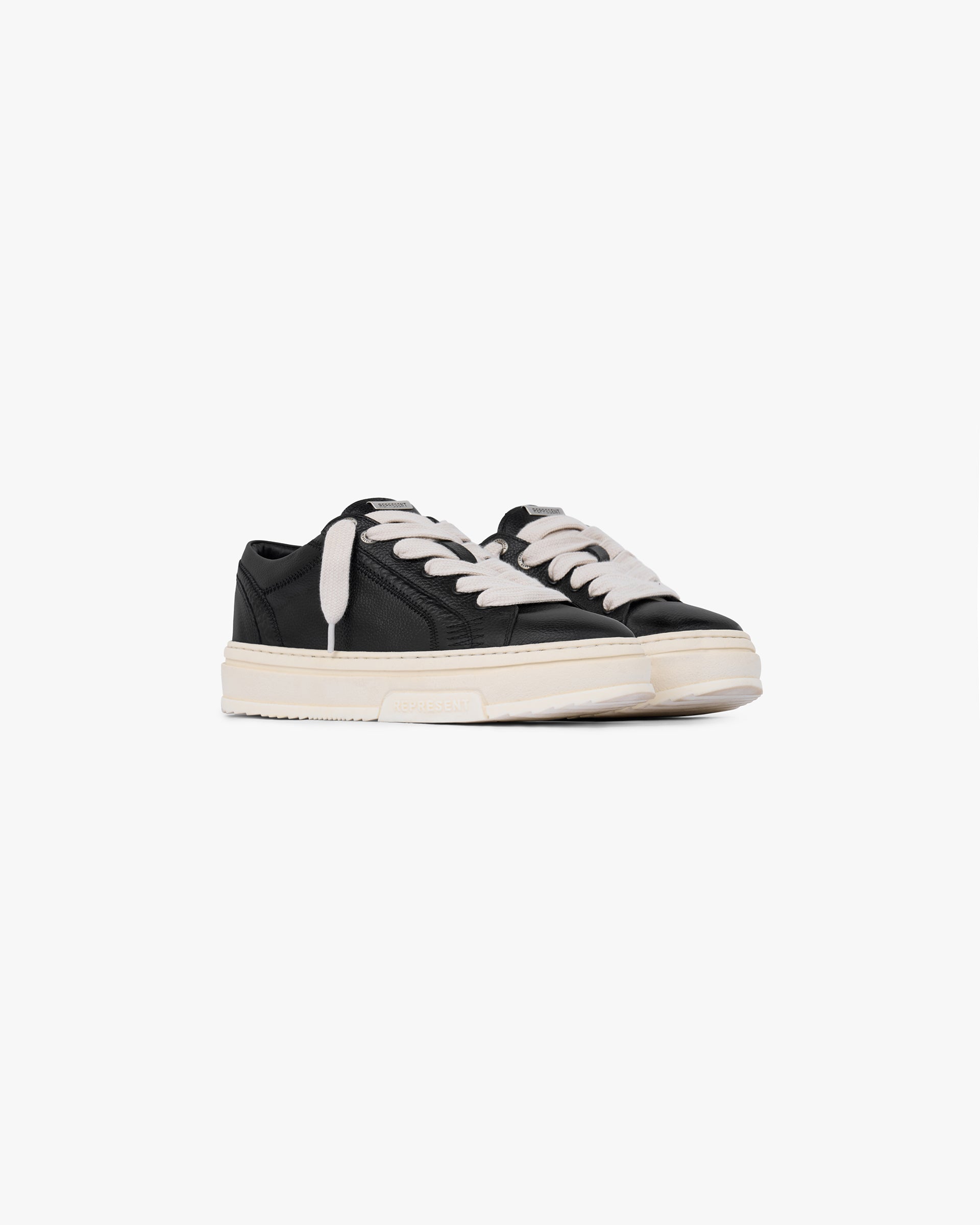 Back product image of a mens black sneaker on a plain white background | HTN Low Tumbled Leather in Black | Low top sneaker with tumbled leather upper and chunky lacing | FW24 Footwear | Represent Clo