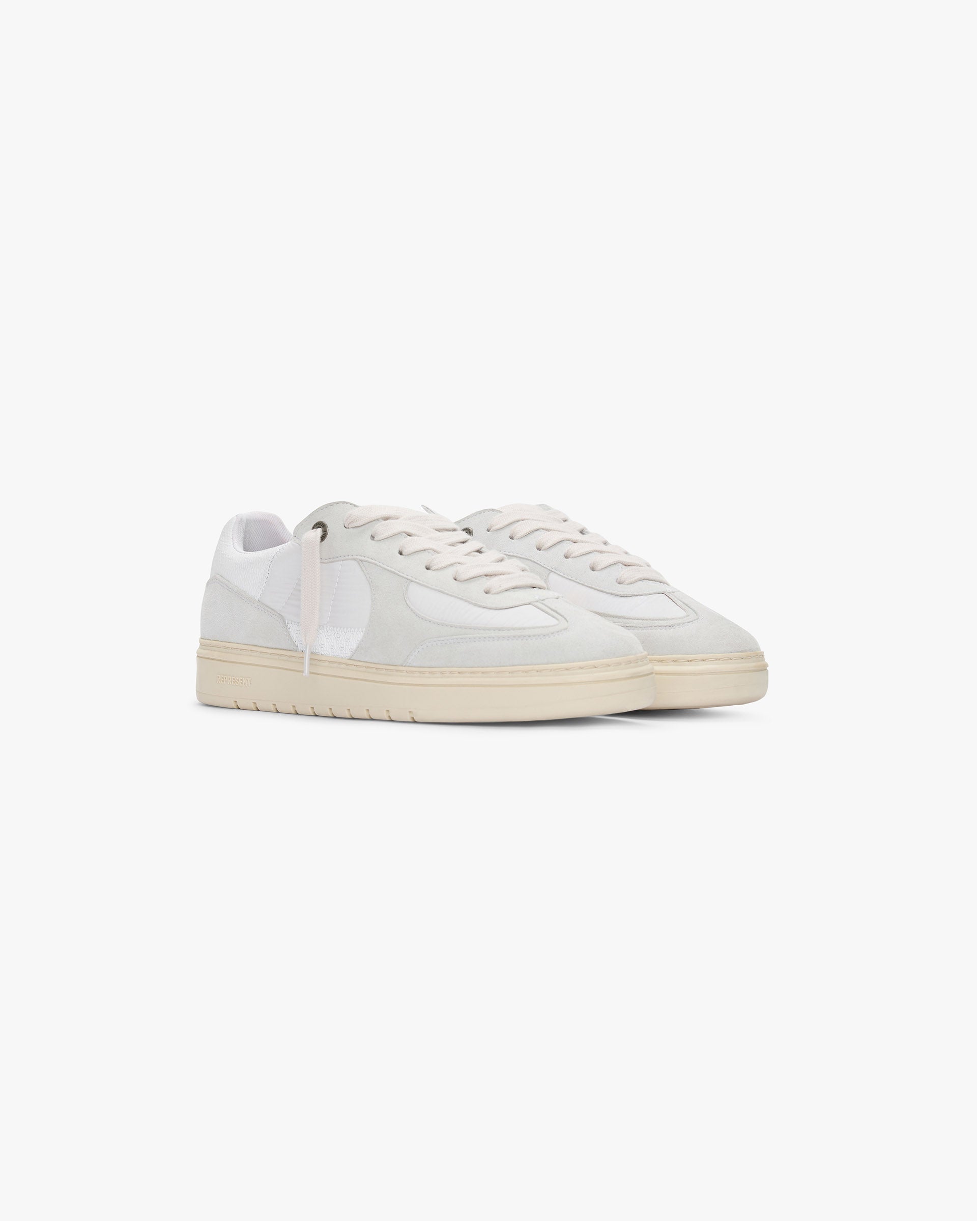 Back product image of a mens white sneaker on a plain white background | Virtus in Vintage White | Low profile sneaker with nubuck panelling and zig zag stitch detail | SS25 Footwear | Represent Clo