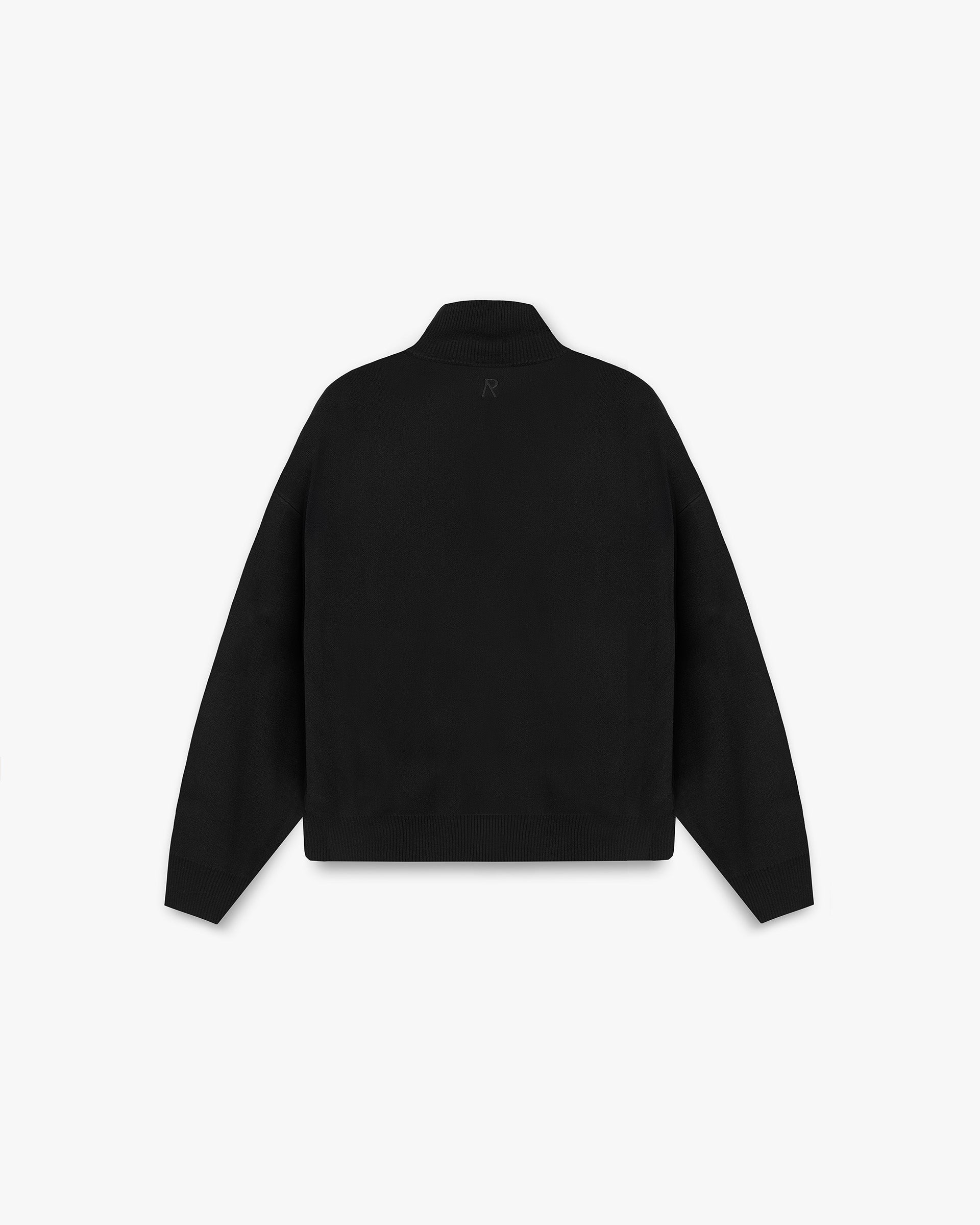 Back product image of a mens black knitted track jacket on a plain white background | Initial Knitted Track Jacket in Jet Black | Oversized fit with RiRi CF zip and welt pockets | Initial Knitwear | Represent Clo