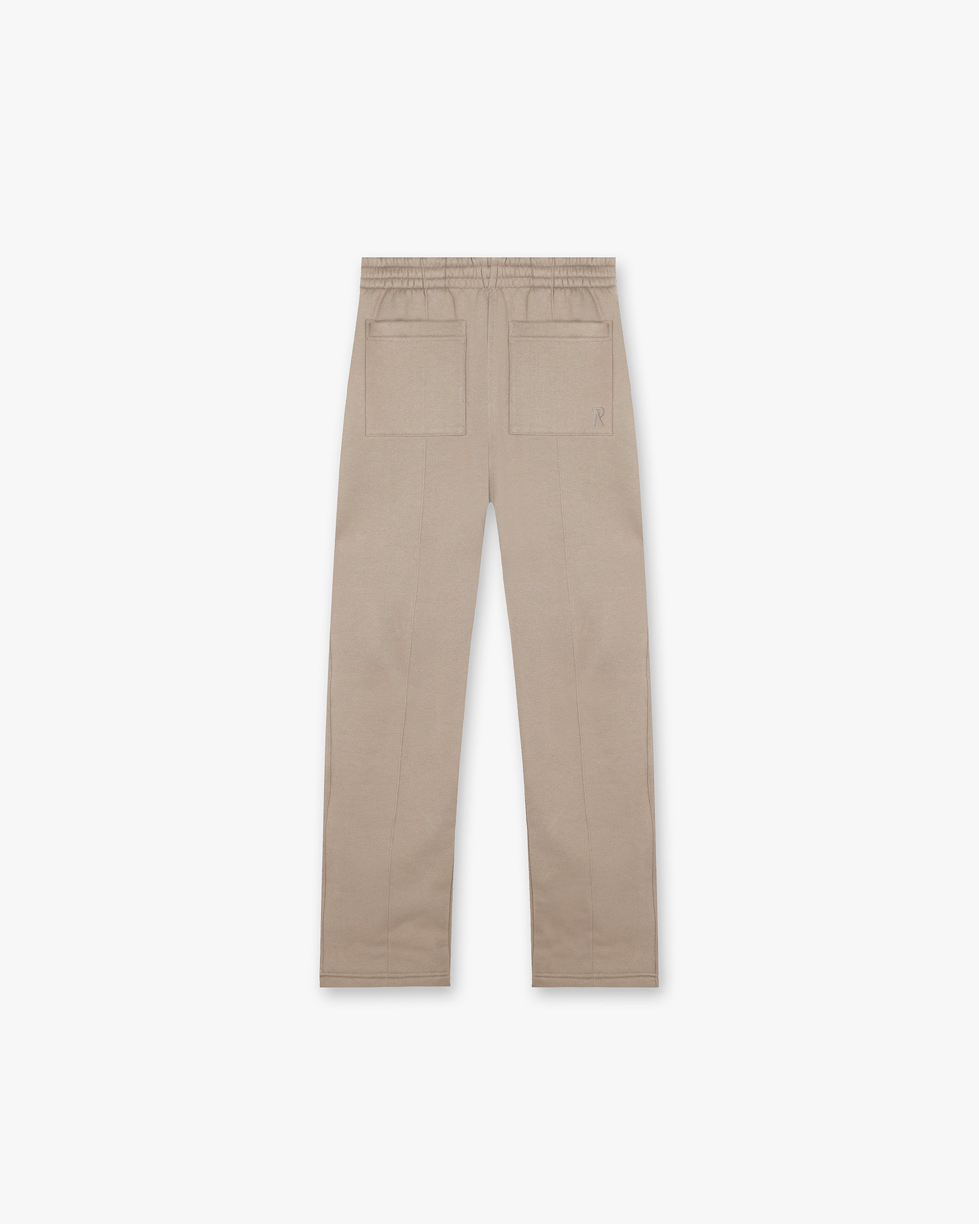 Back product image of mens sweatpants in beige on a plain white background | Initial Sweatpants in Dune | Wide leg sweatpants with pintuck detail and split hem | Initial Pants | Represent Clo