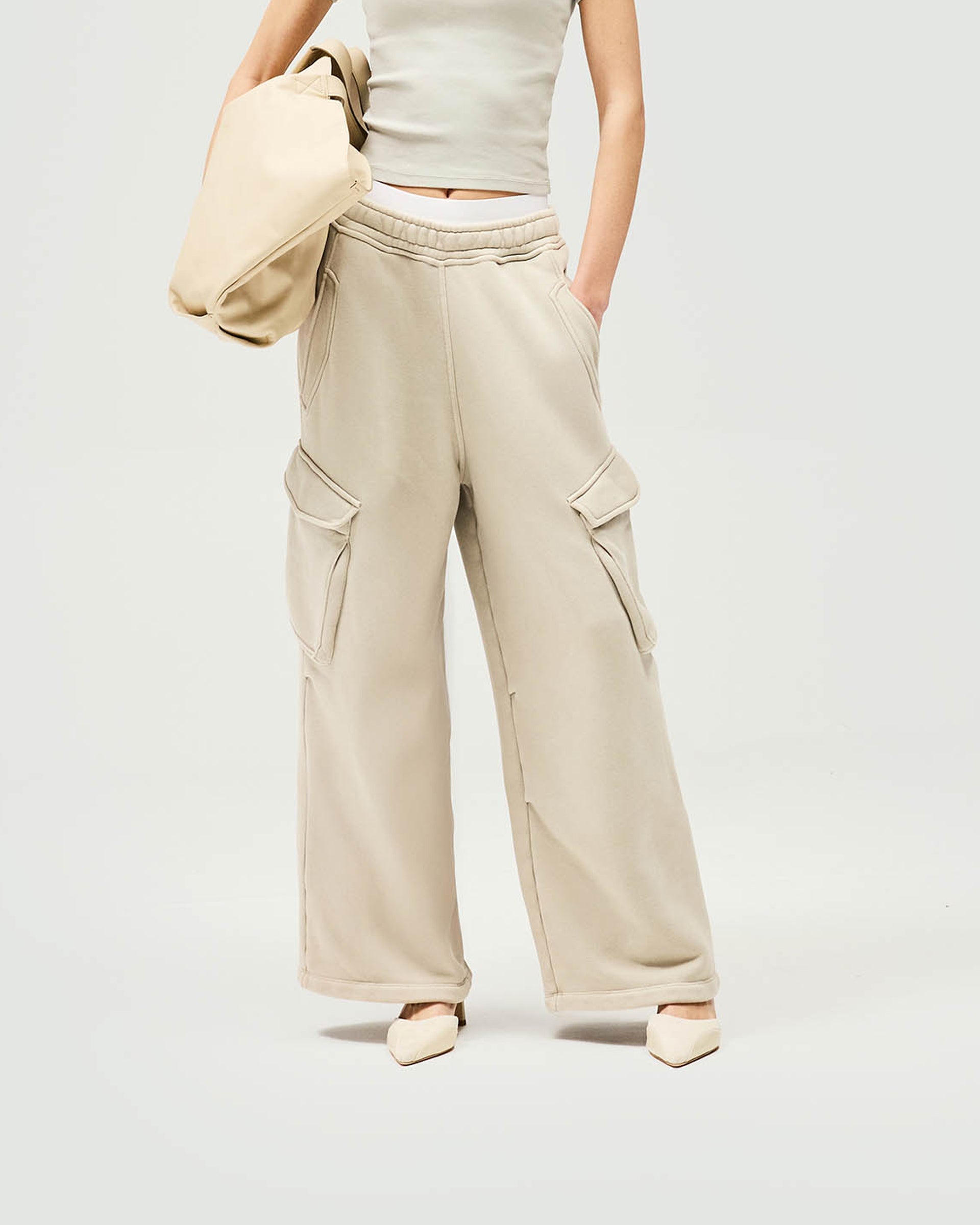 Woman wearing relaxed fit grey cargo jogger on a plain white background | Initial Cargo Jogger in Storm | Heavyweight cotton joggers with patch pockets | Womens Initial Bottoms | Represent Clo