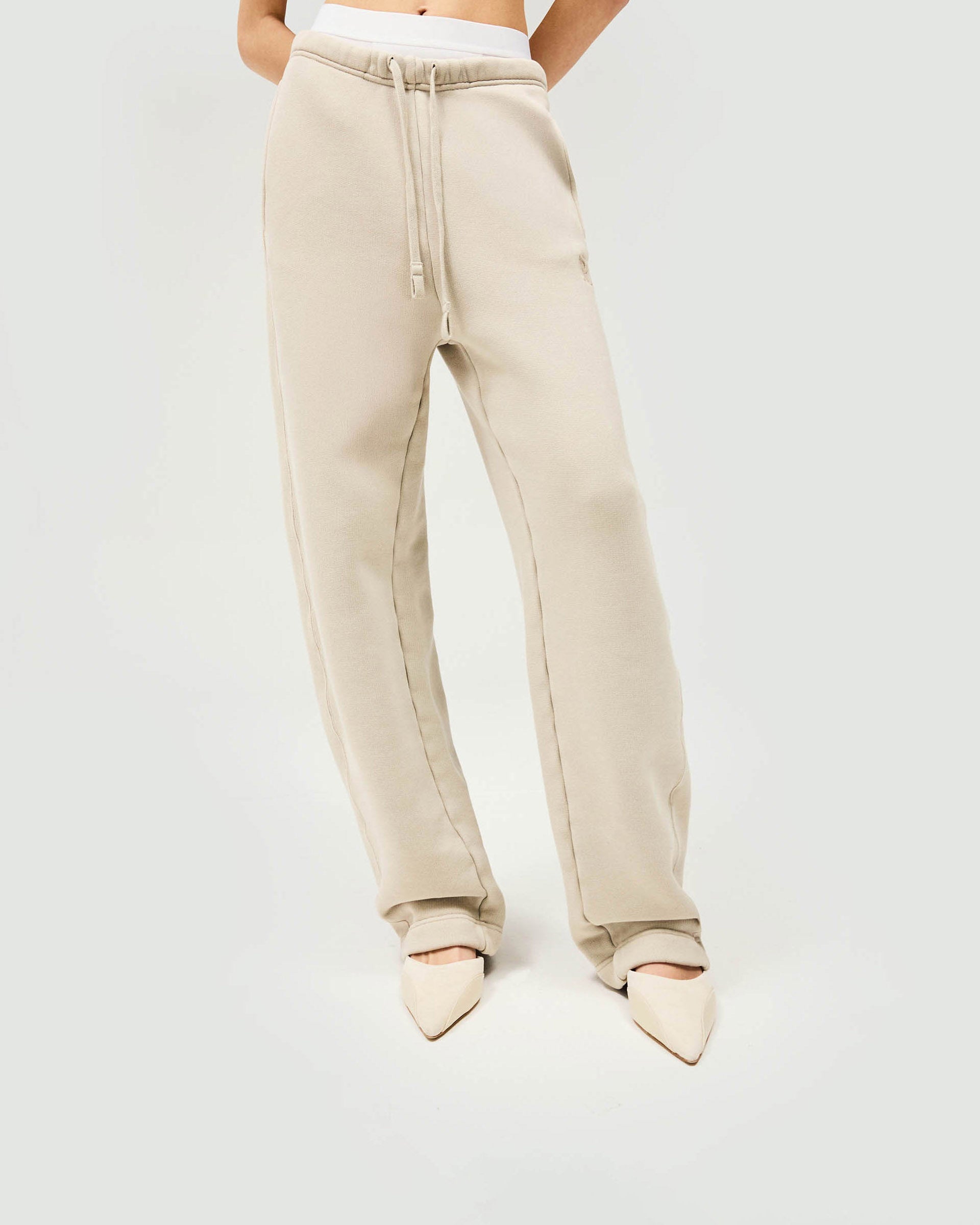 Woman wearing storm-colored joggers on a plain white background | Initial Twisted Seam Jogger in Storm | Heavyweight joggers with twisted side seams and elasticised waist | Womens Initial Bottoms | Represent Clo
