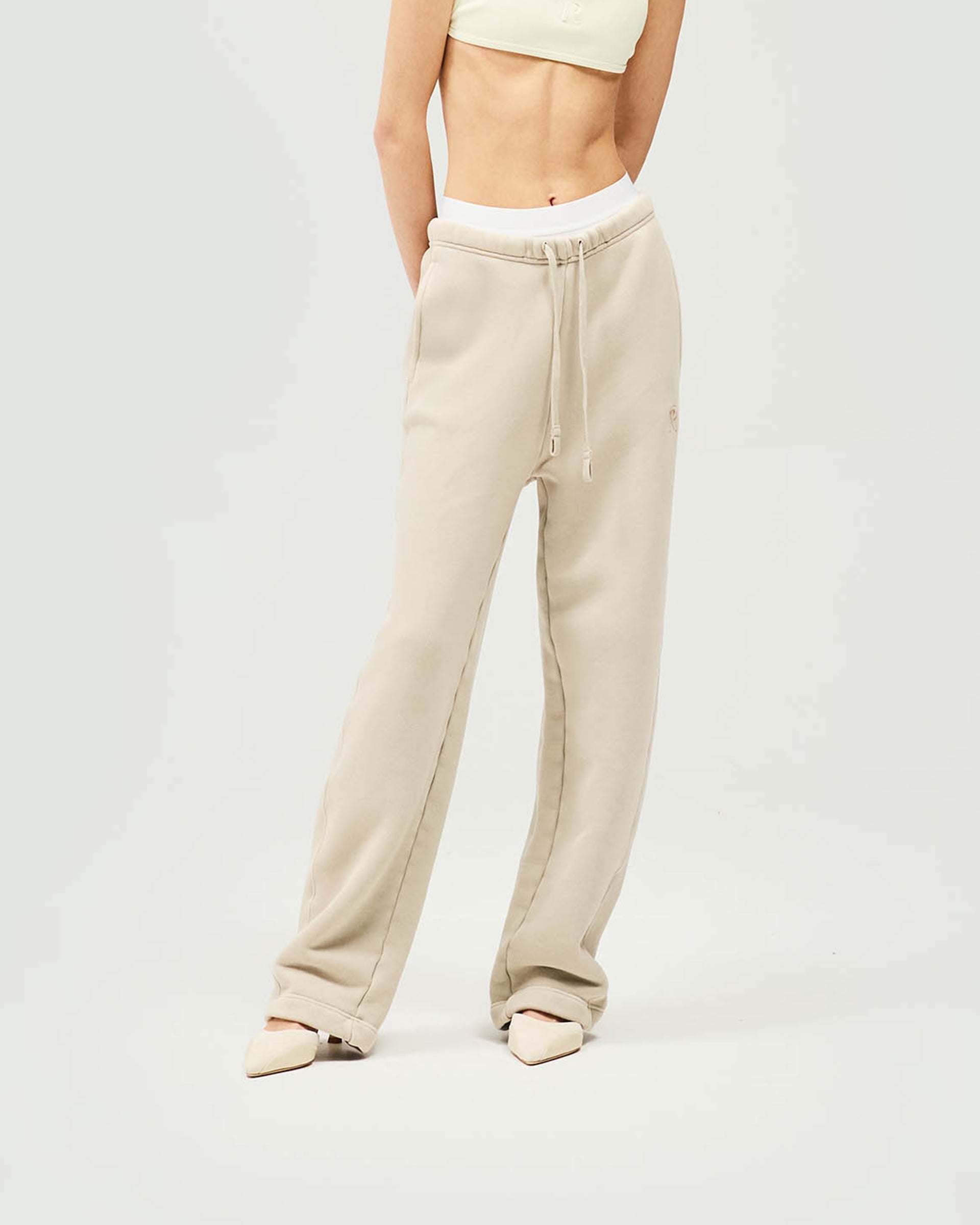 Back product image of womens grey joggers on a plain white background | Initial Twisted Seam Jogger in Storm | Joggers with twisted side seams and cocoon shape | Womens Initial Bottoms | Represent Clo