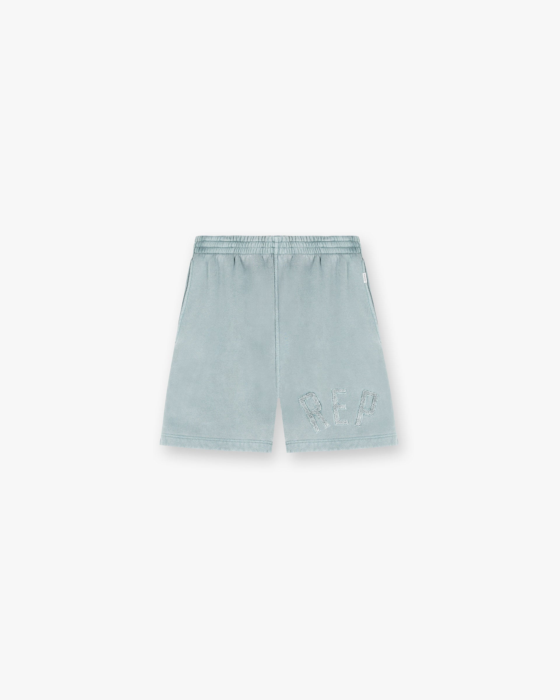 Front product image of mens green shorts on a plain white background | Rep Applique Shorts in Forest Green | Viscose blend shorts | SS25 Shorts | Represent Clo