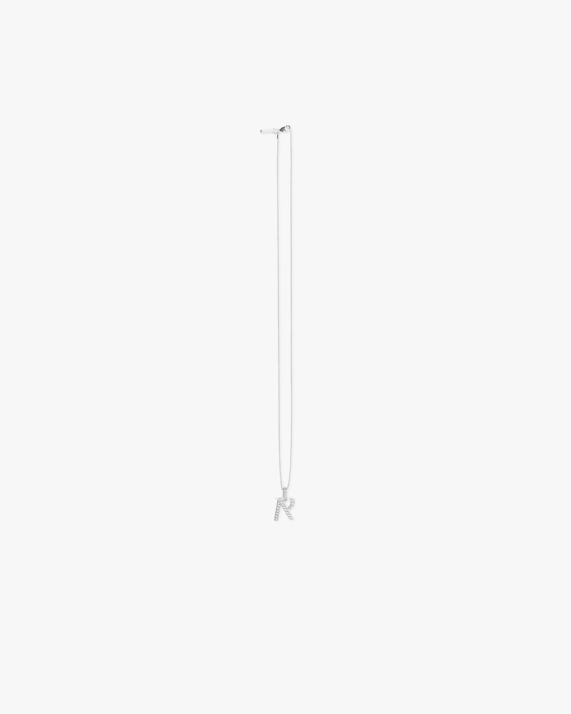 Front product image of a mens silver pendant on a plain white background | Pavé R Pendant in Silver | Silver pendant accessory with luxury design | FW23 Accessories | Represent Clo