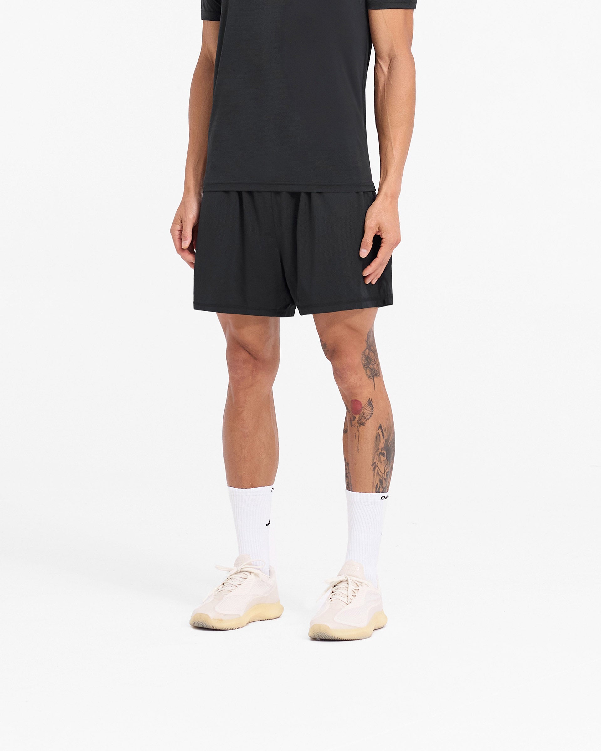 Back product image of mens black mesh shorts on a plain white background | 247 DNA Mesh Shorts in Black | Oversized training shorts with zip pockets and side split hem | 247 Shorts | Represent Clo