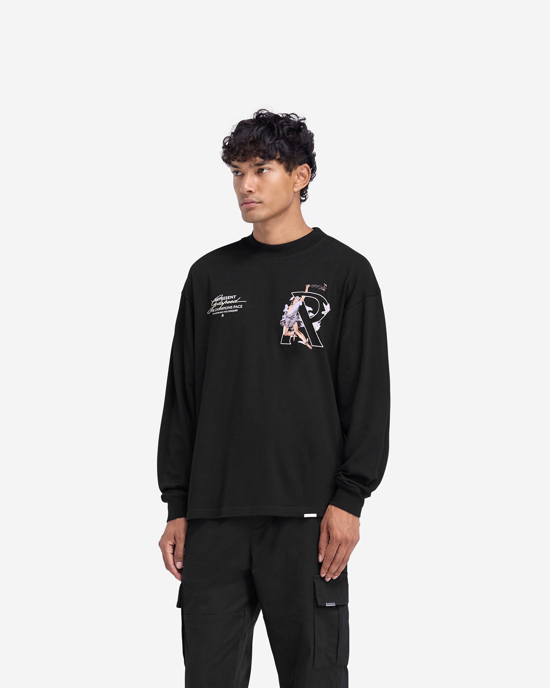 Man wearing a black long sleeve t-shirt on a plain white background | Hermes Long Sleeve T-Shirt in Jet Black | Slightly oversized t-shirt with high density graphic | FW24 T-Shirts | Represent Clo