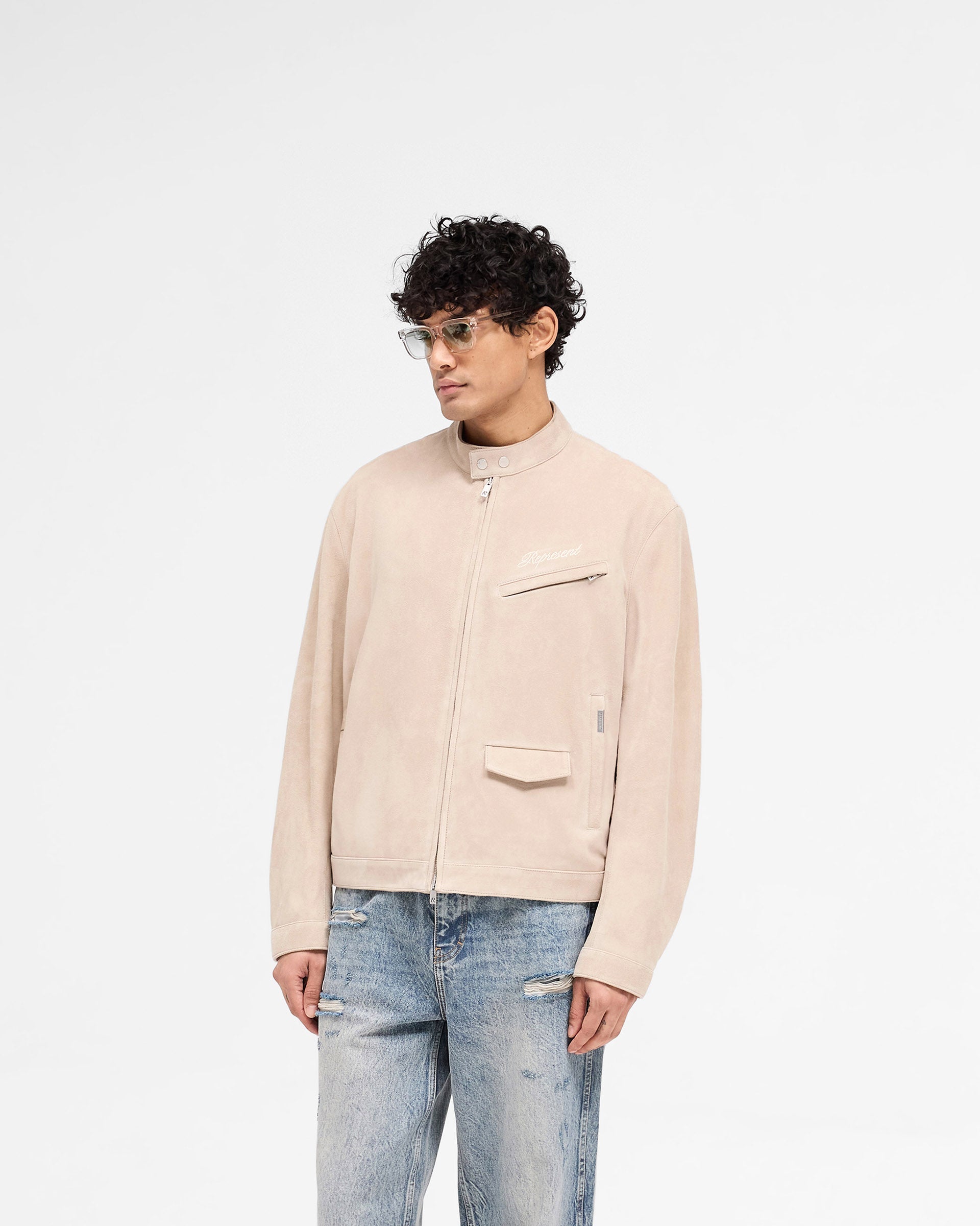 Back product image of a mens beige suede jacket on a plain white background | Overdrive Suede Jacket in Beige | Suede jacket with biker neck and vented shoulders | SS25 Outerwear | Represent Clo