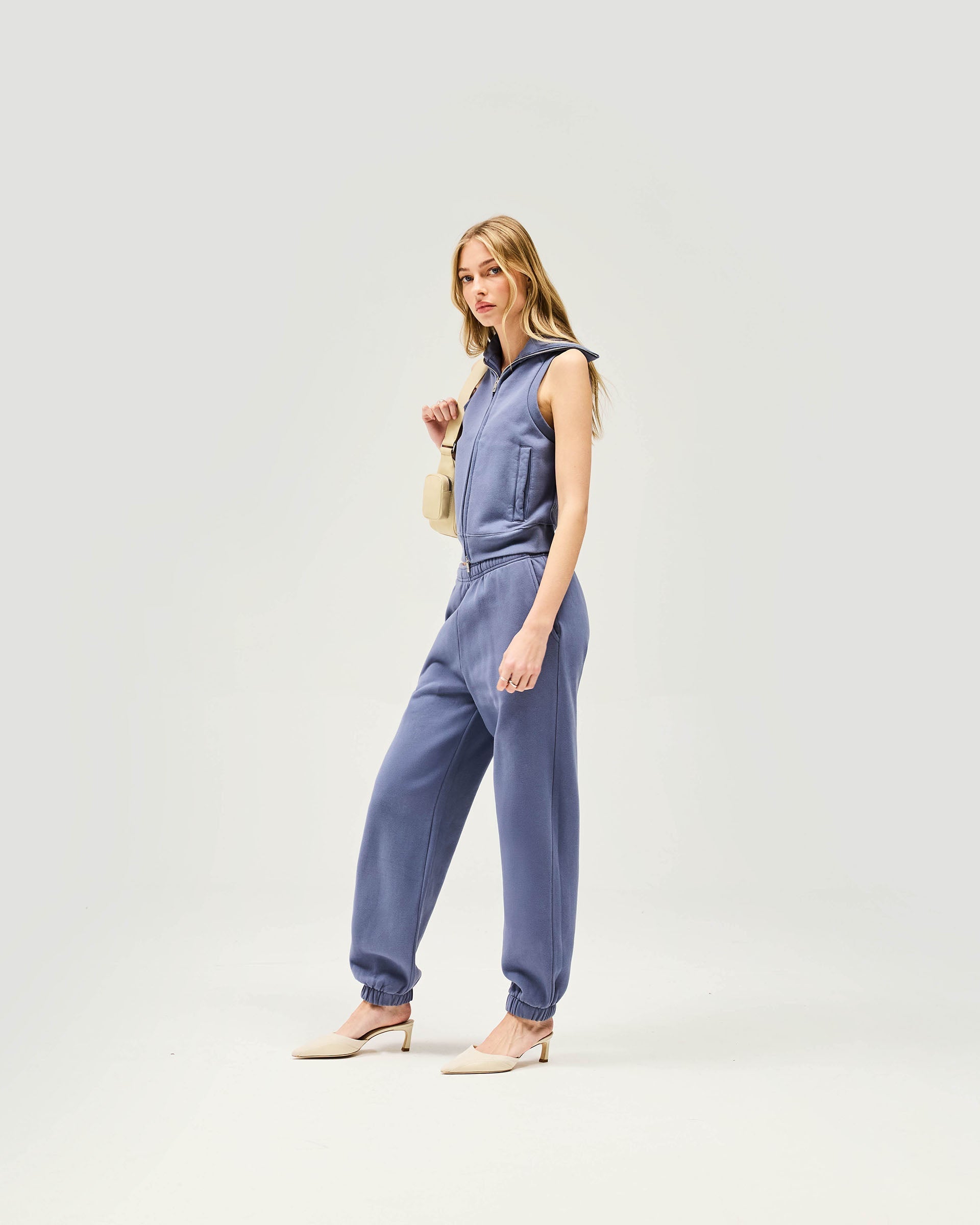 Back product image of a womens blue gilet on a plain white background | Owners Club Gilet in Steel Blue | Slim fit brushed cotton fleece gilet with ribbed hem | Womens Owners Club Outerwear | Represent Clo