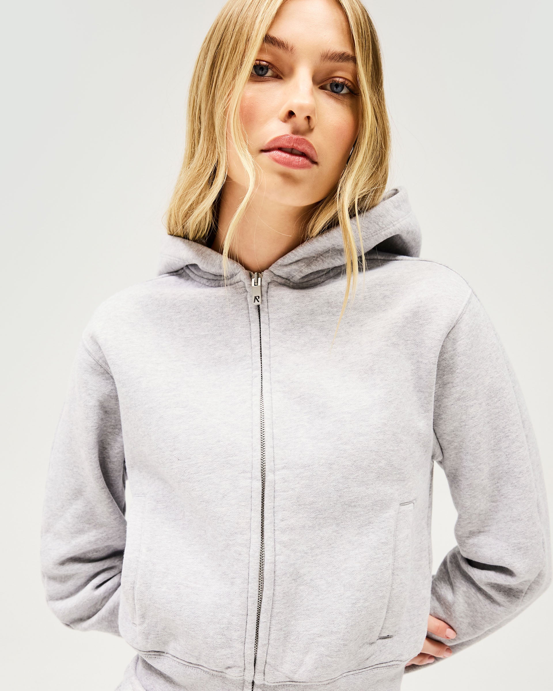 Back product image of a womens grey hoodie on a plain white background | Owners Club Slim Zip Hoodie in Grey Marl | Cropped slim fit zip hoodie with side entry welt pockets | Womens Owners Club Hoodies | Represent Clo