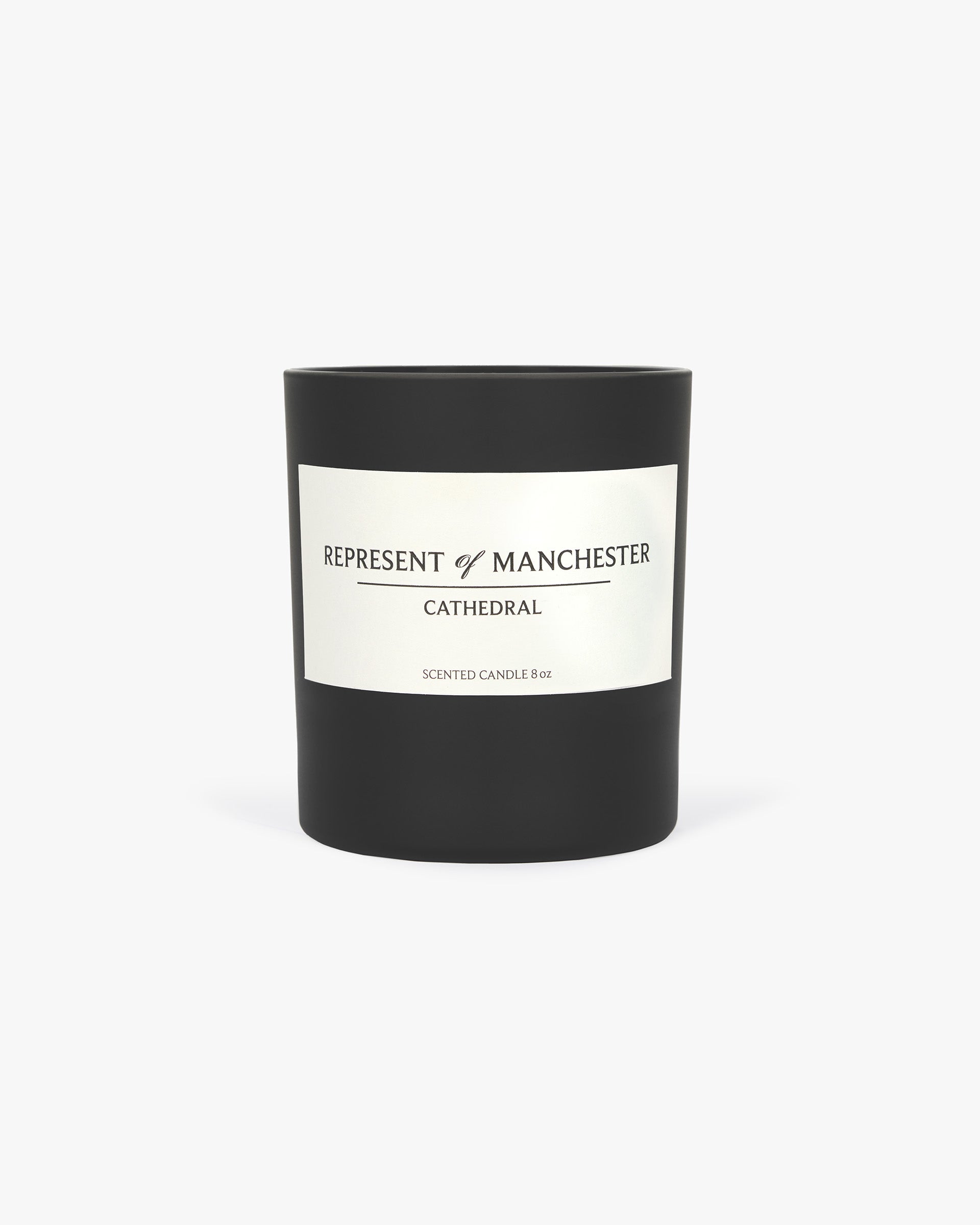 Front product image of a matte black candle on a plain white background | Manchester Store Candle in Matte Black | Sleek candle design | Exclusives Accessories | Represent Clo