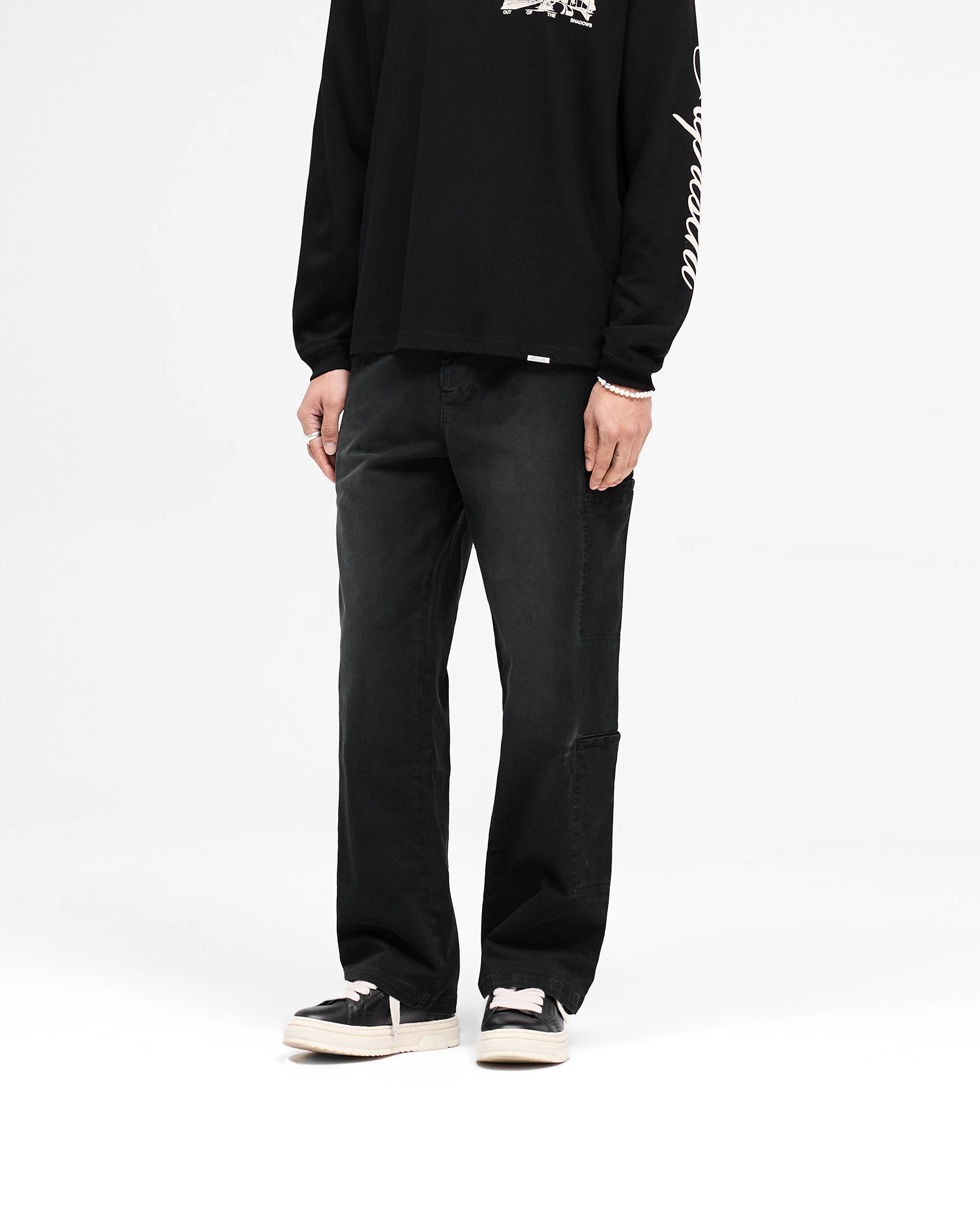Back product image of mens black cargo pants on a plain white background | Season Cargo Pant in Jet Black | Cargo pants with eight pockets and relaxed fit | SS25 Pants | Represent Clo